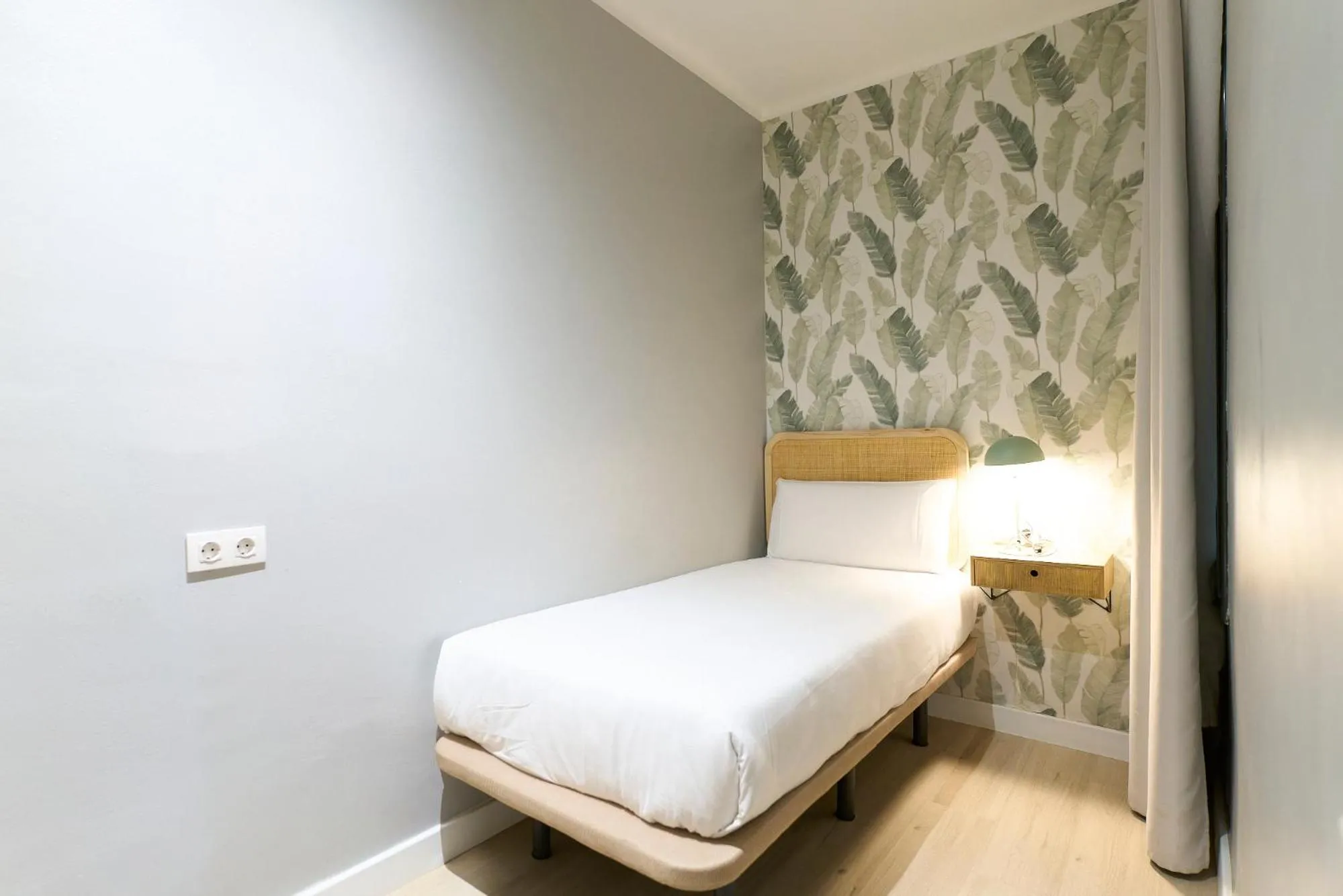 Bed in Fira Apartments by gaiarooms