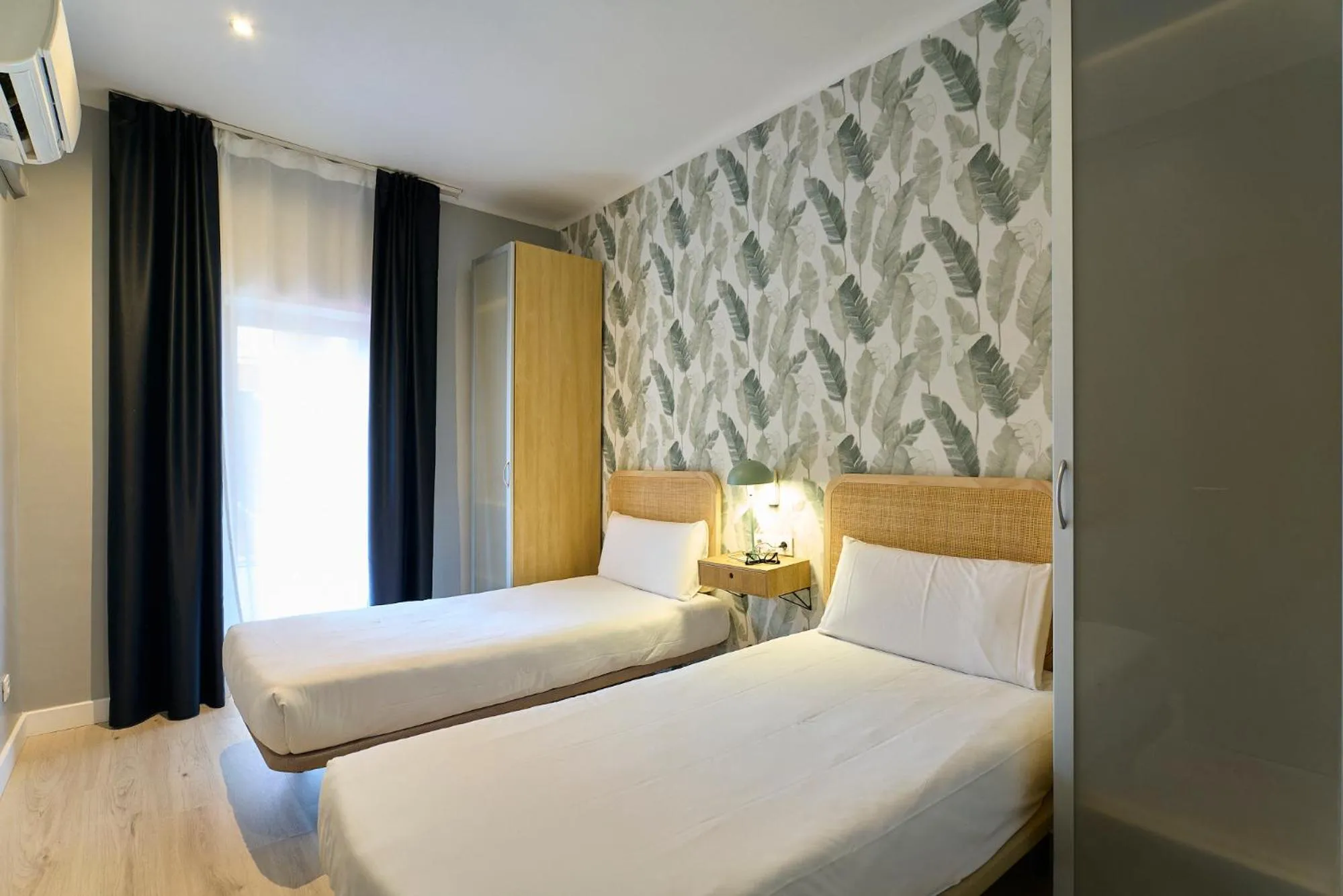 Bed in Fira Apartments by gaiarooms