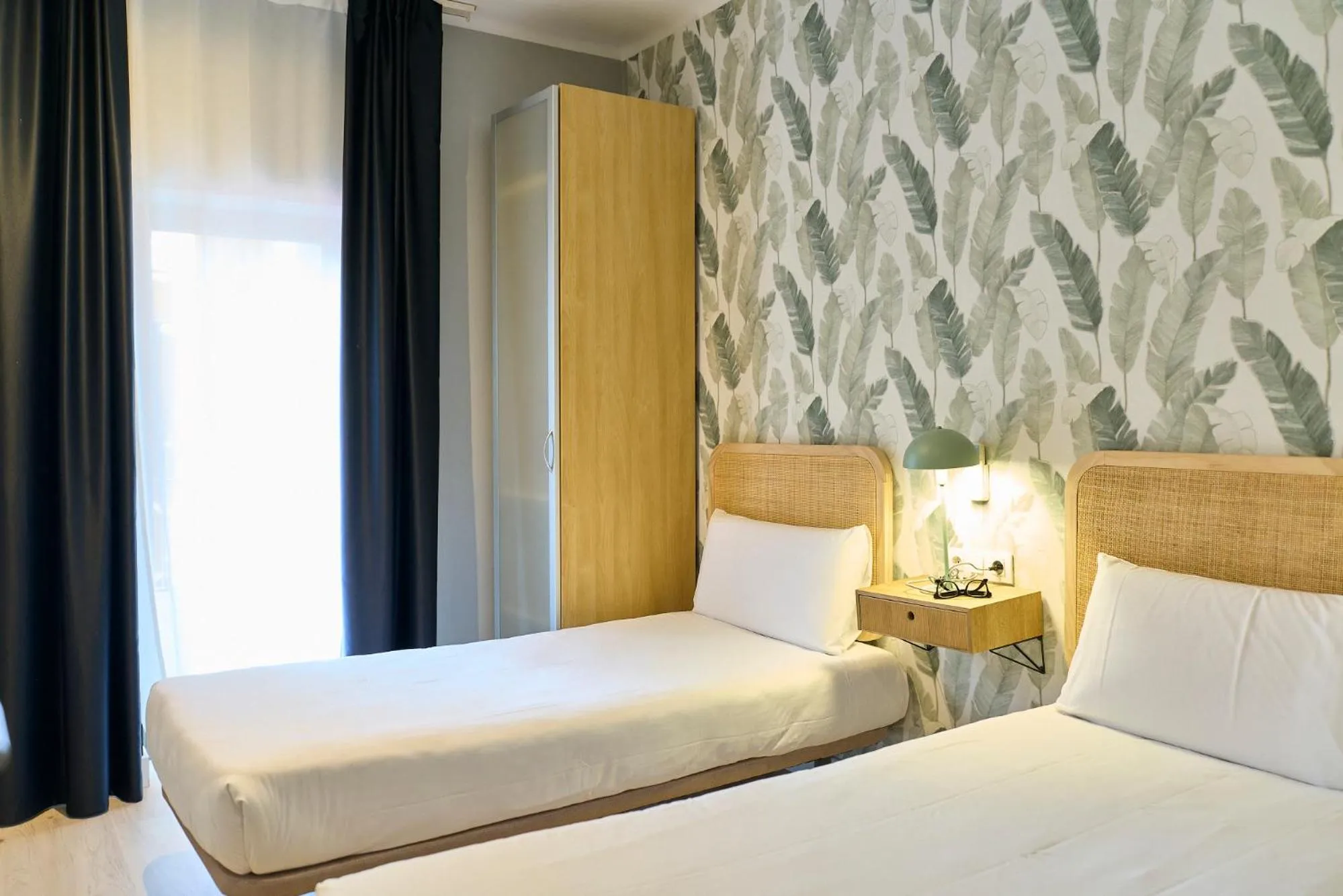 Bed in Fira Apartments by gaiarooms