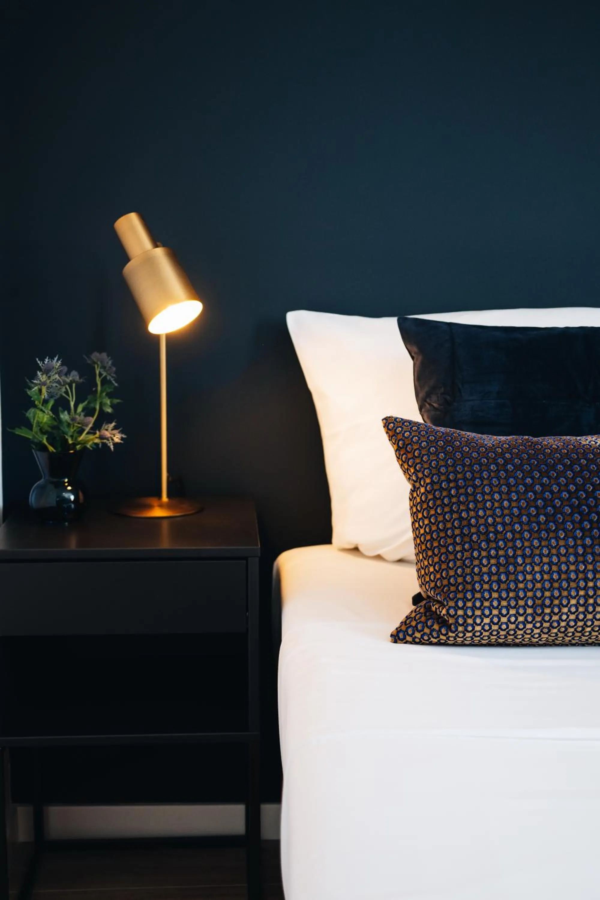 Bed in The Roosevelt Apartments