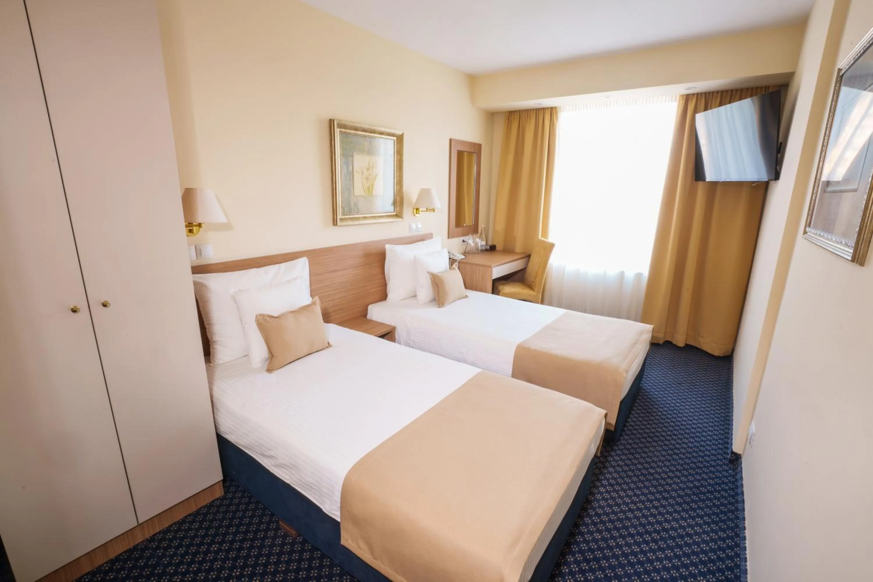 Bed in Hotel Monogram Park