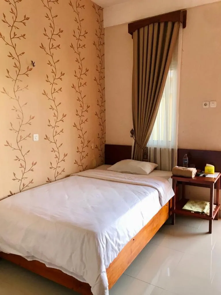 Bed in Penginapan Intan Bandara