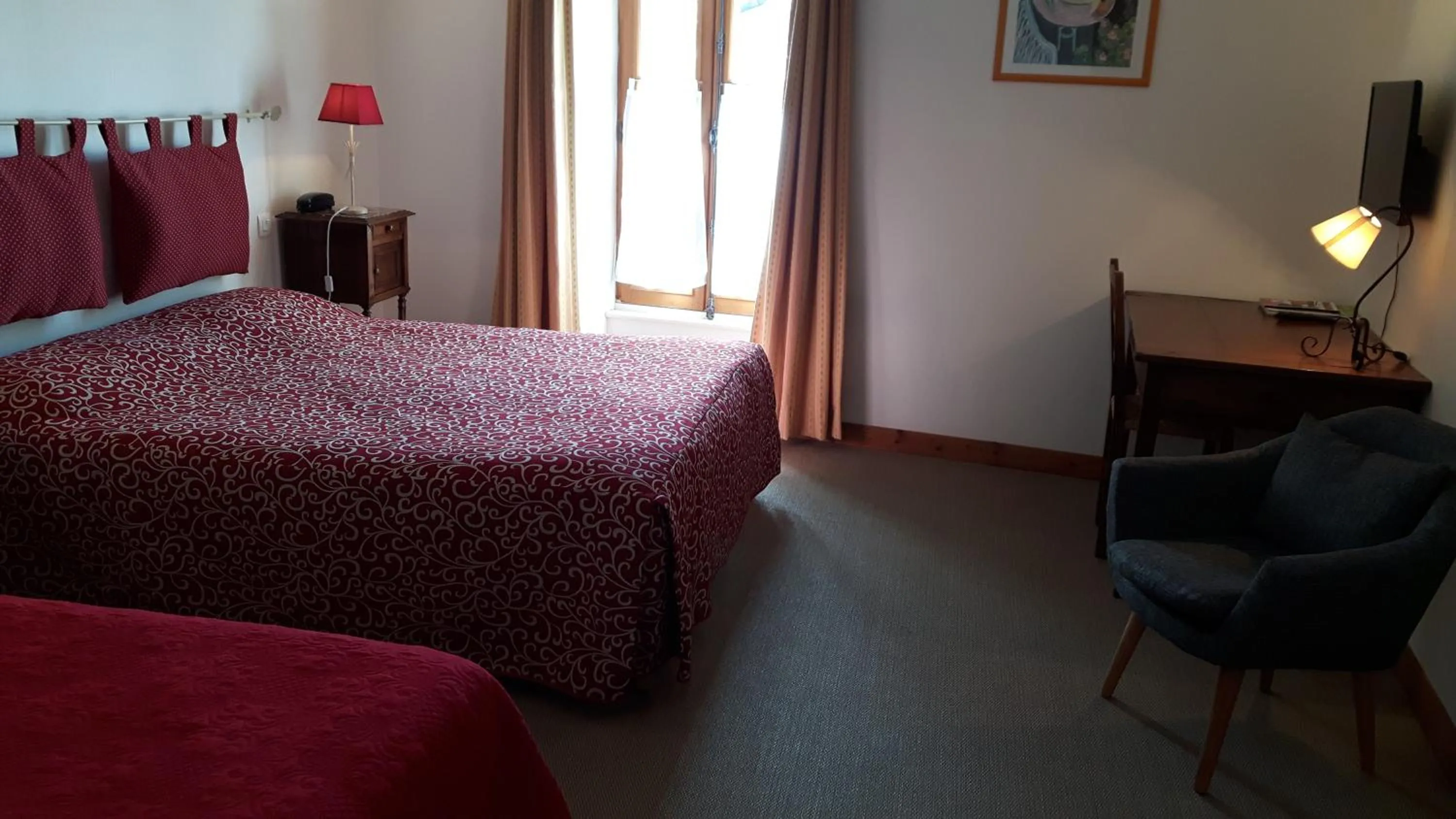 Bed in Hôtel du Donjon