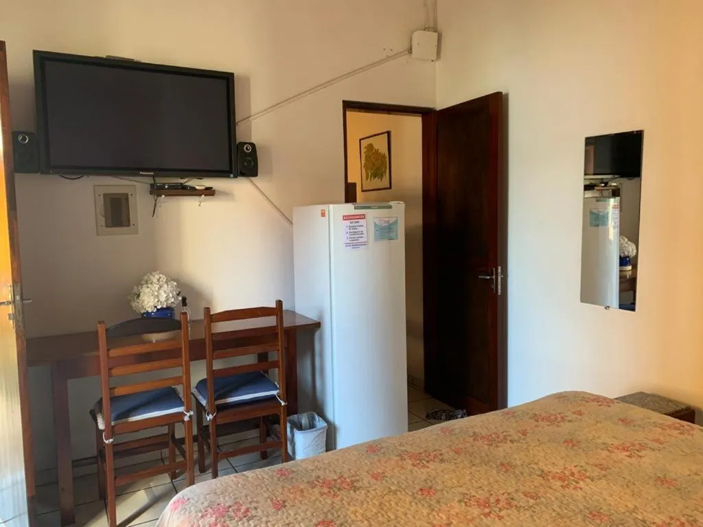 Bed in Pousada Irmãos do Mar