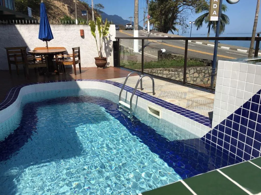 Swimming pool in Pousada Irmãos do Mar