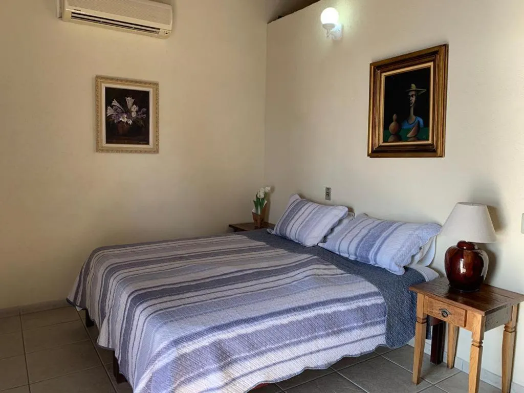 Bed in Pousada Irmãos do Mar