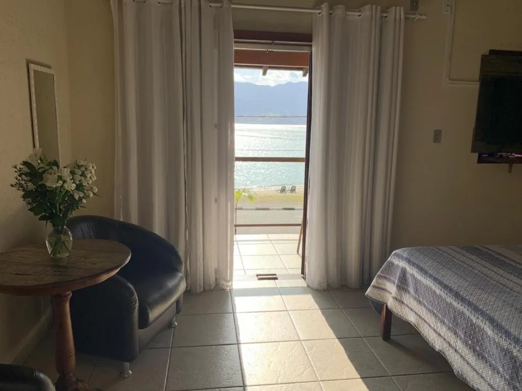 Bed in Pousada Irmãos do Mar