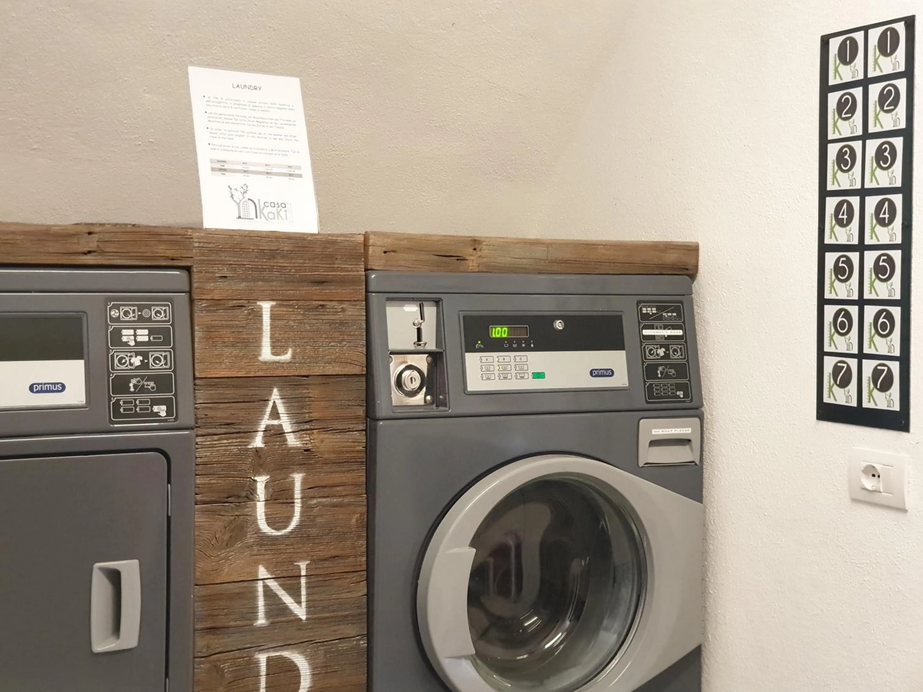 washing machine in Casa Kaki - Eco friendly Apartments with Parking & Private Courtyard