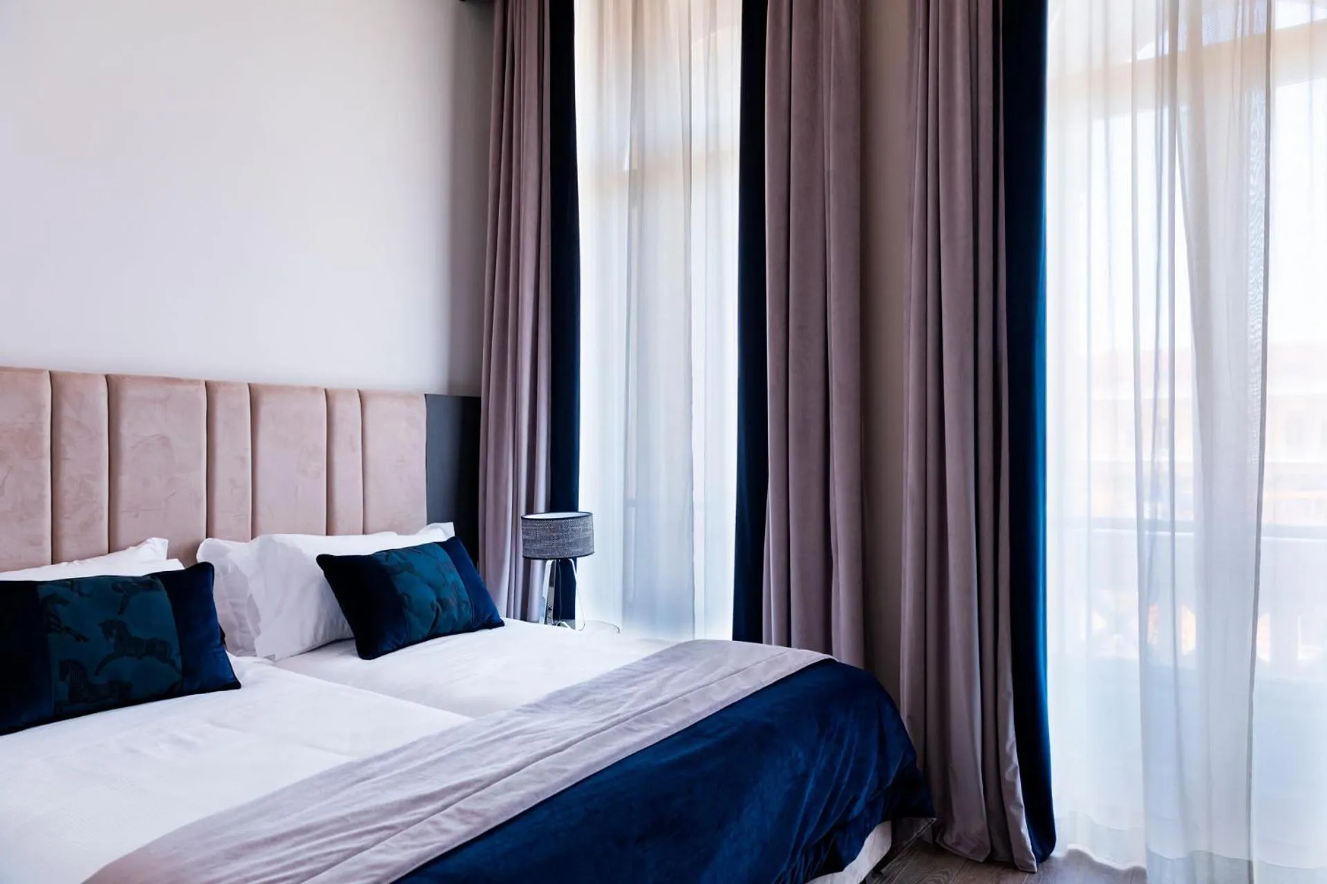 Bed in Amadomus Luxury Suites