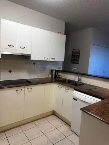 Kitchen or kitchenette in Kings Row Apartments