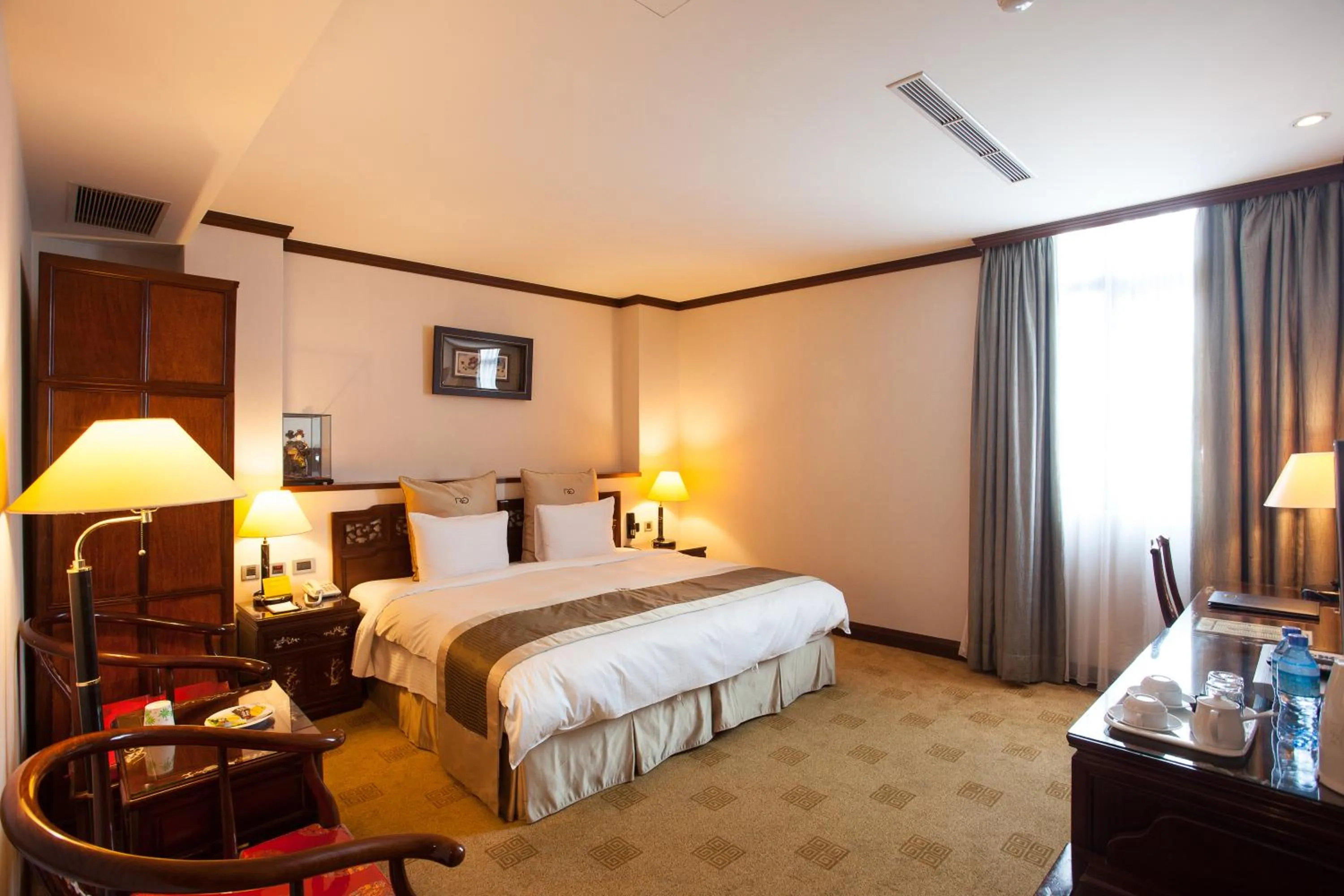 Bed in Rich Garden Hotel