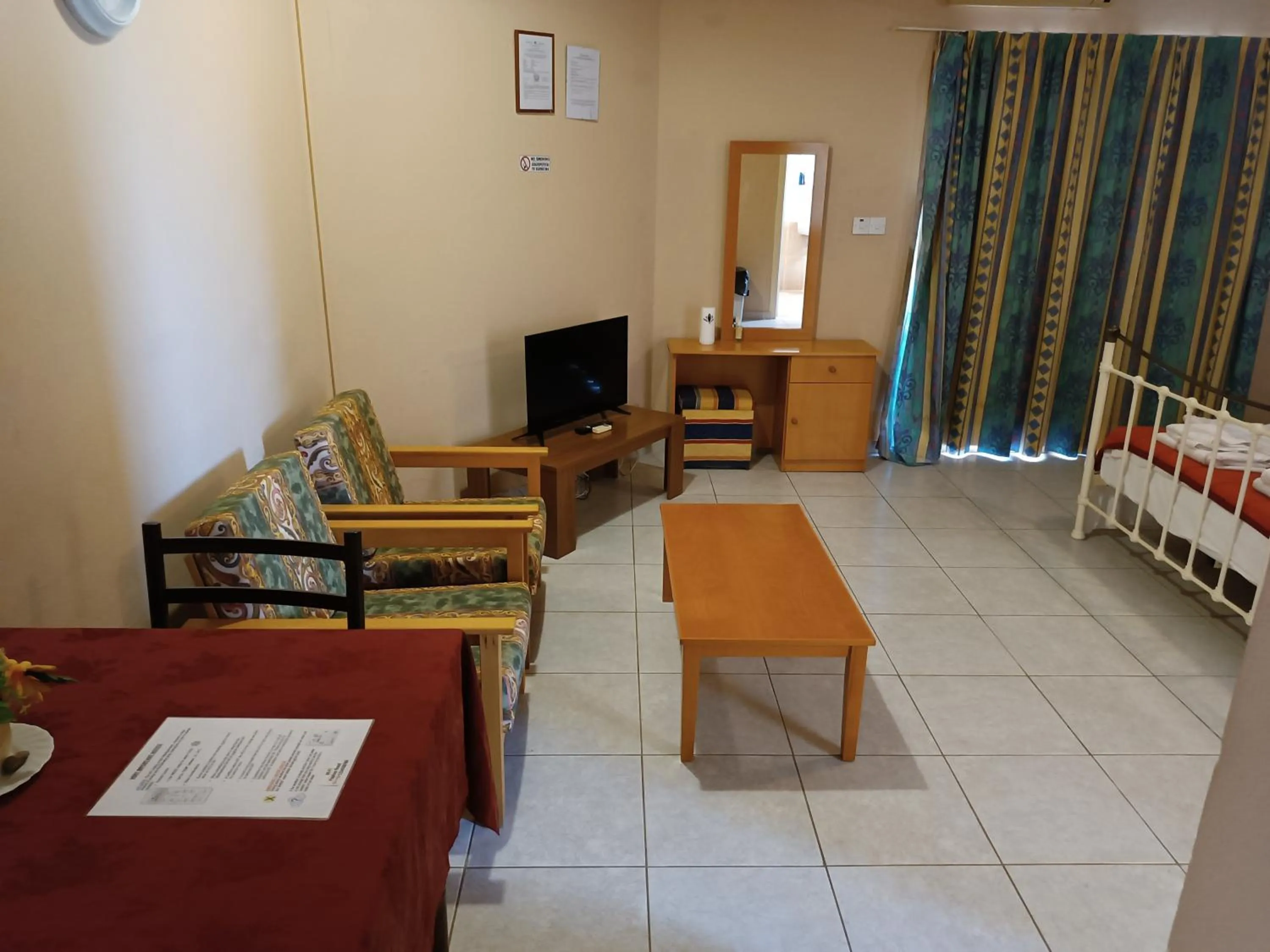 Seating area, Bed in Rantzo Holiday Apartments