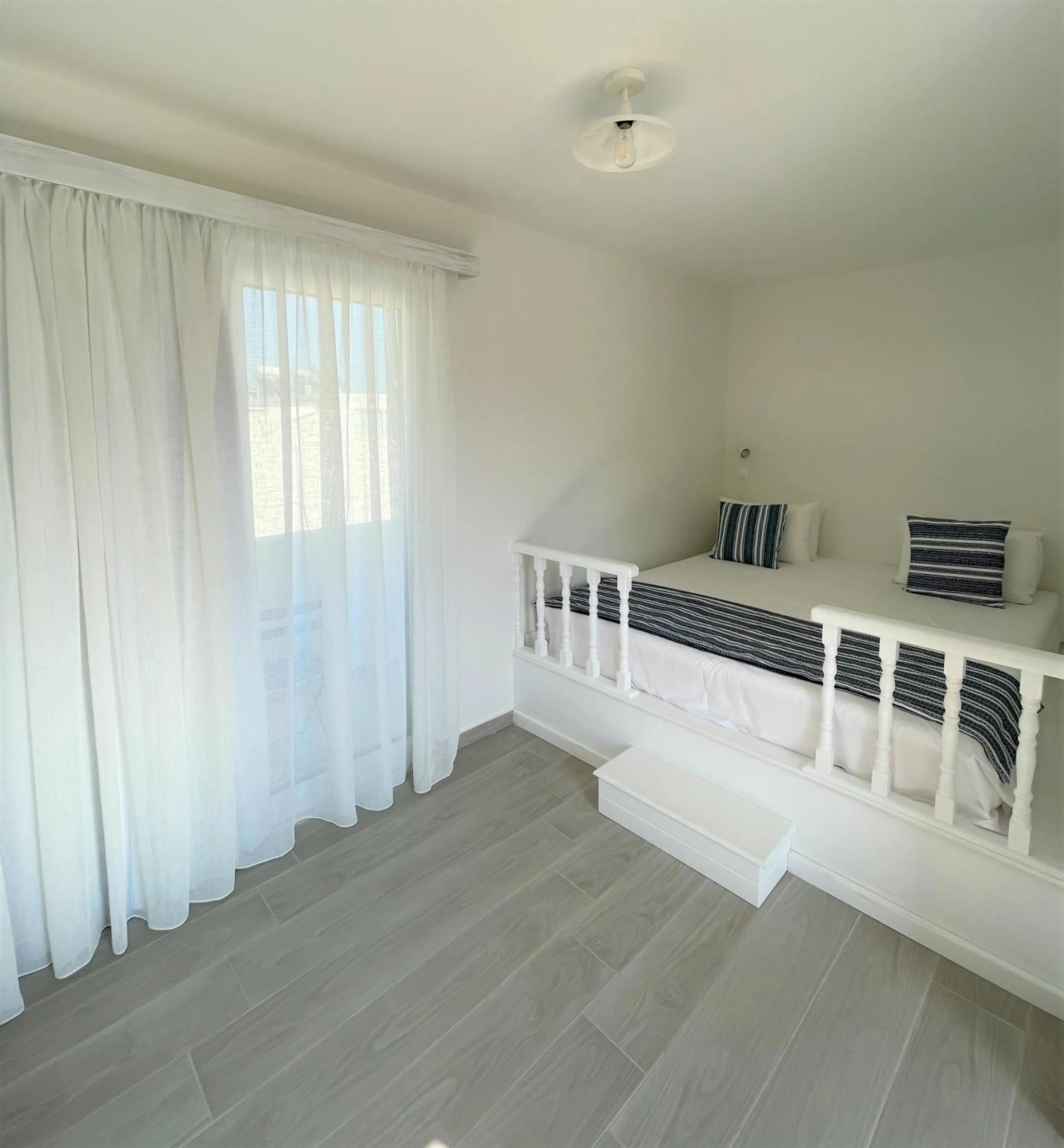 Bed in Stegna Akti Luxury Suites