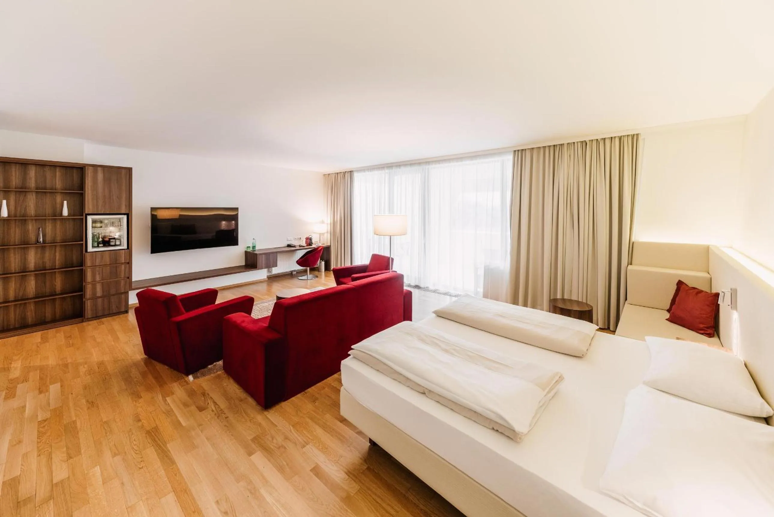 Communal lounge/ TV room, Bed in Thermenhotel Karawankenhof