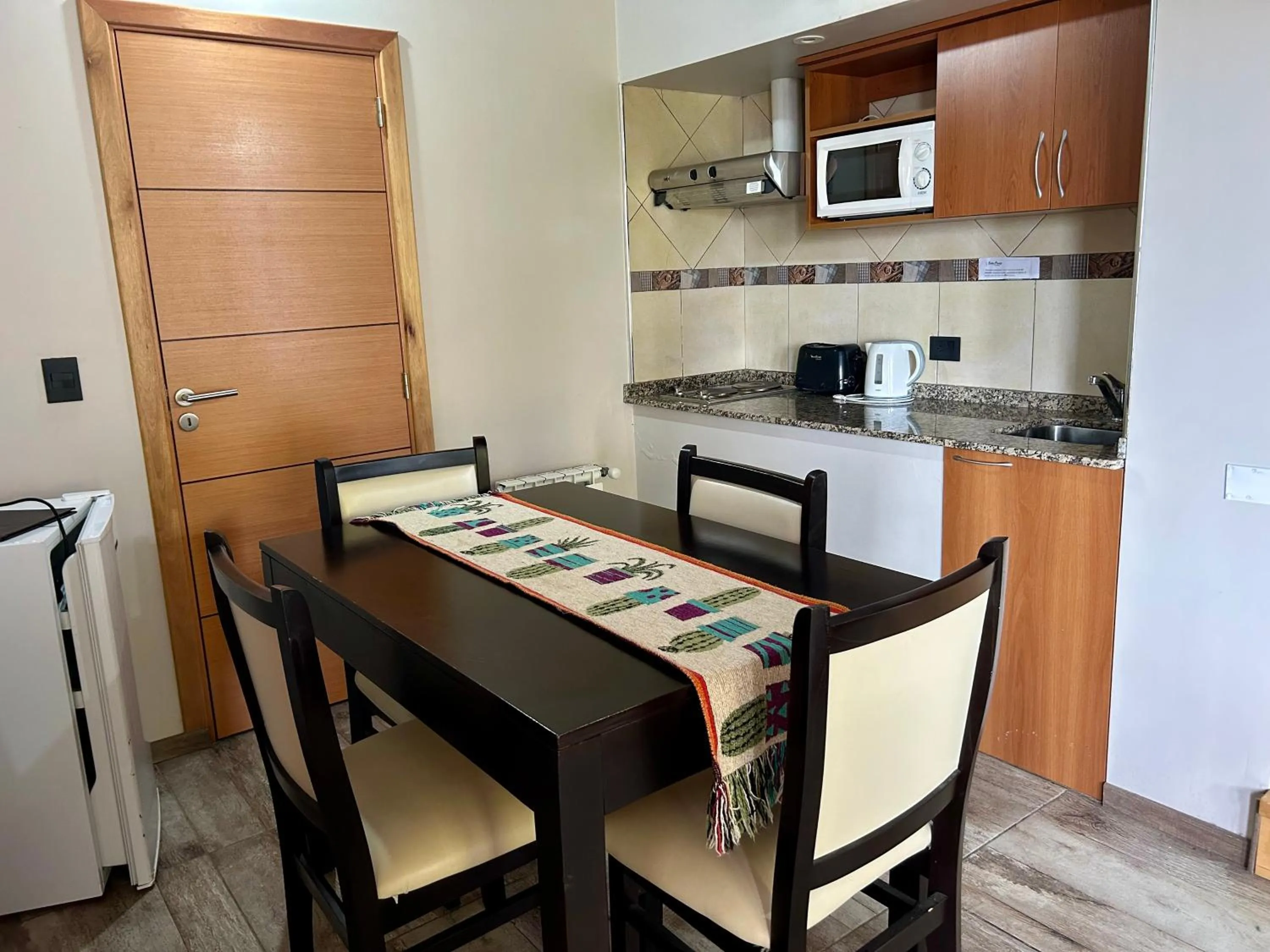 Kitchen or kitchenette in Bahia Paraiso Apart & Suites