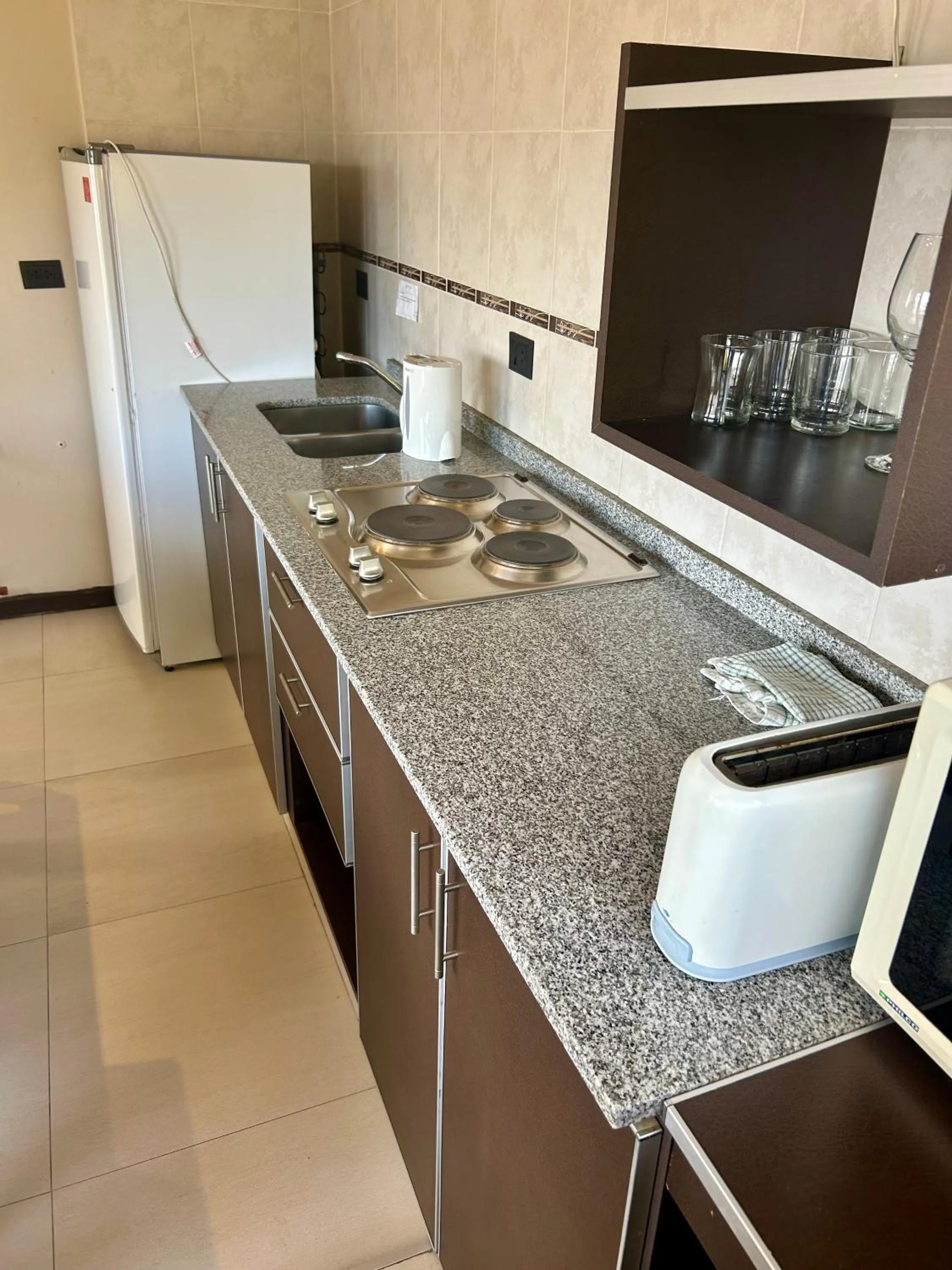Kitchen or kitchenette in Bahia Paraiso Apart & Suites