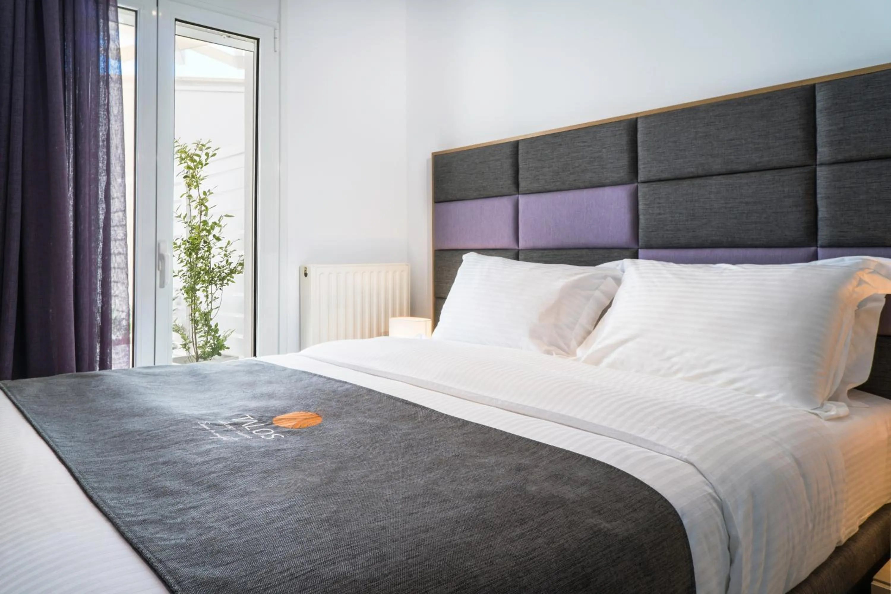 Bed in Talos Luxury Suites