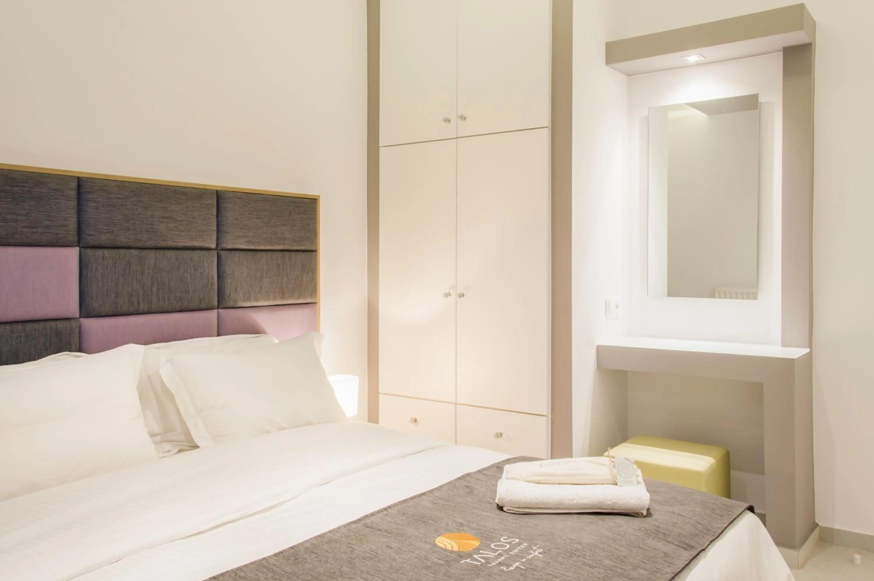 Bed in Talos Luxury Suites