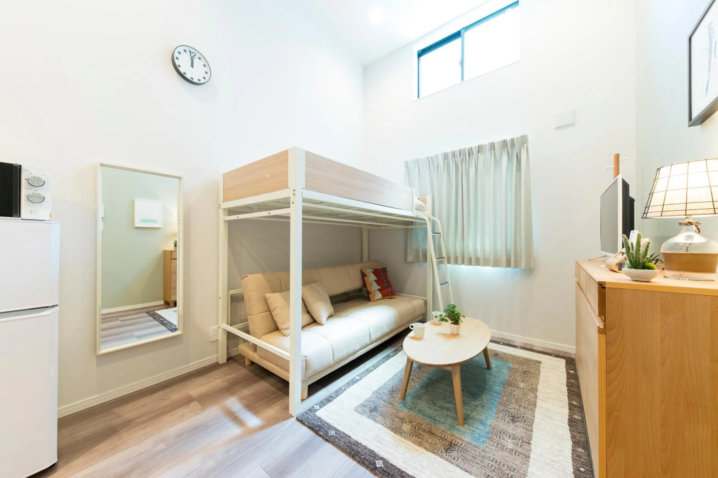 Living room, Bed in TRIP POD TOJIN-MACHI A