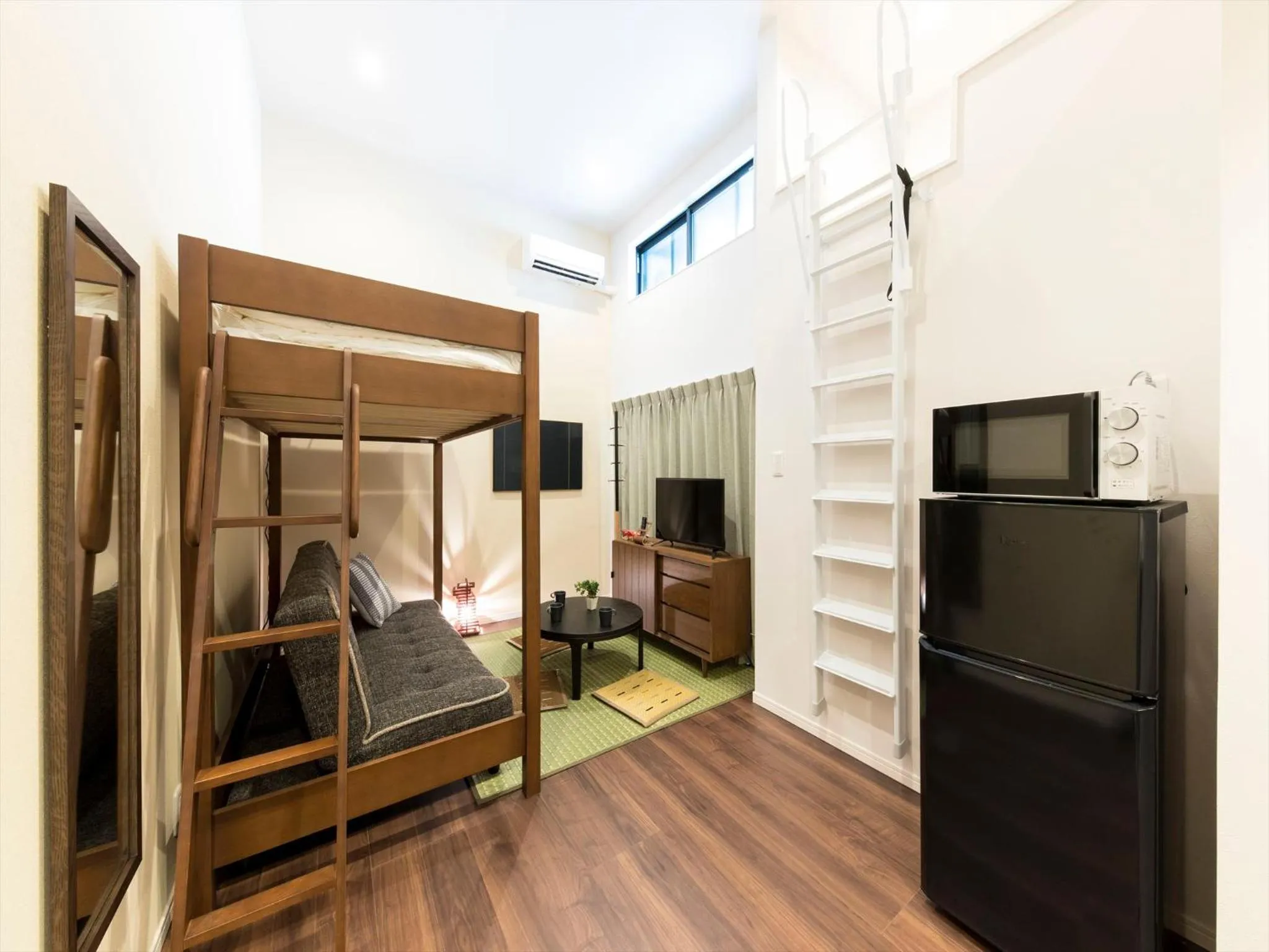 Living room, Bed in TRIP POD SUMIYOSHI A