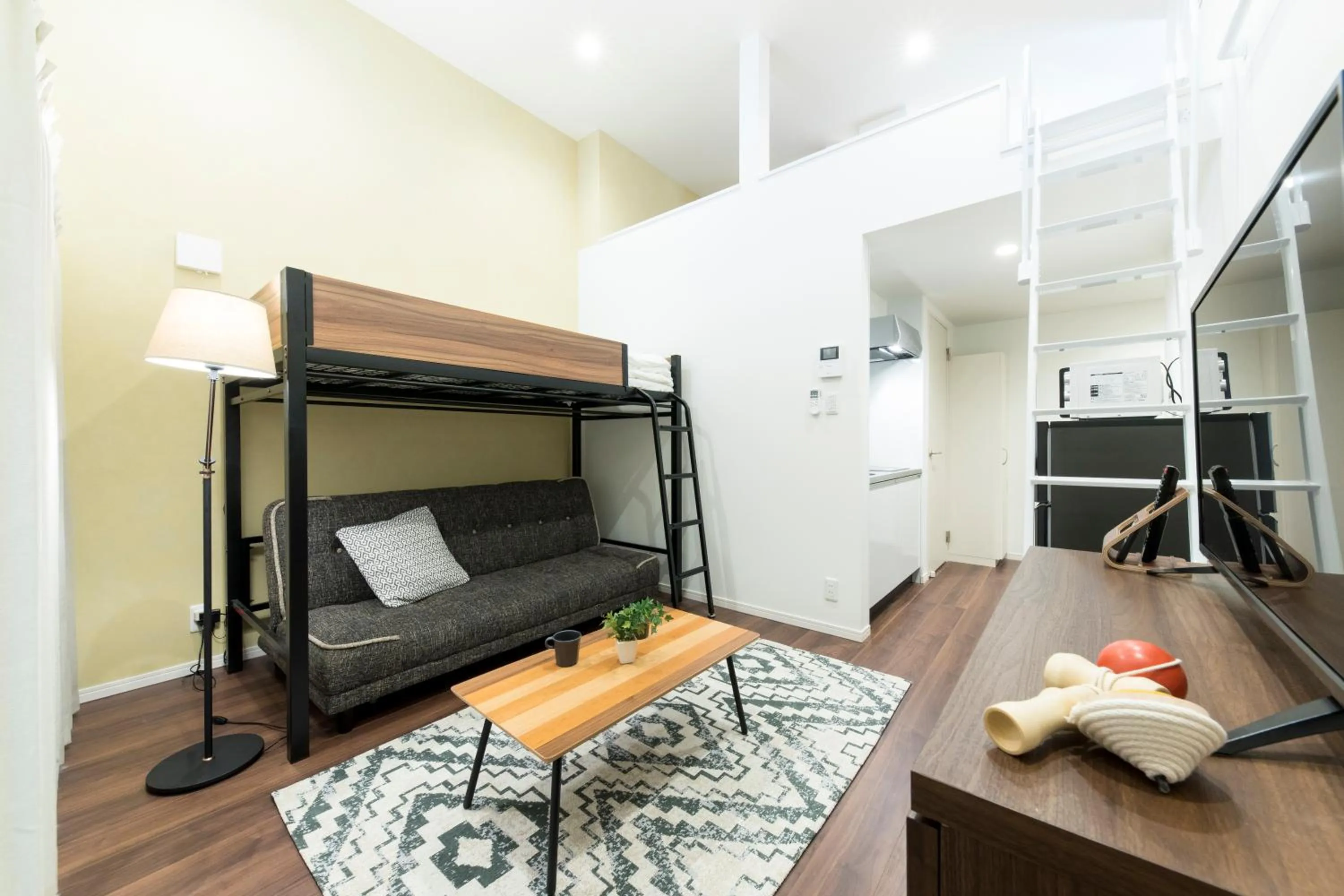Living room, Bed in TRIP POD SUMIYOSHI A