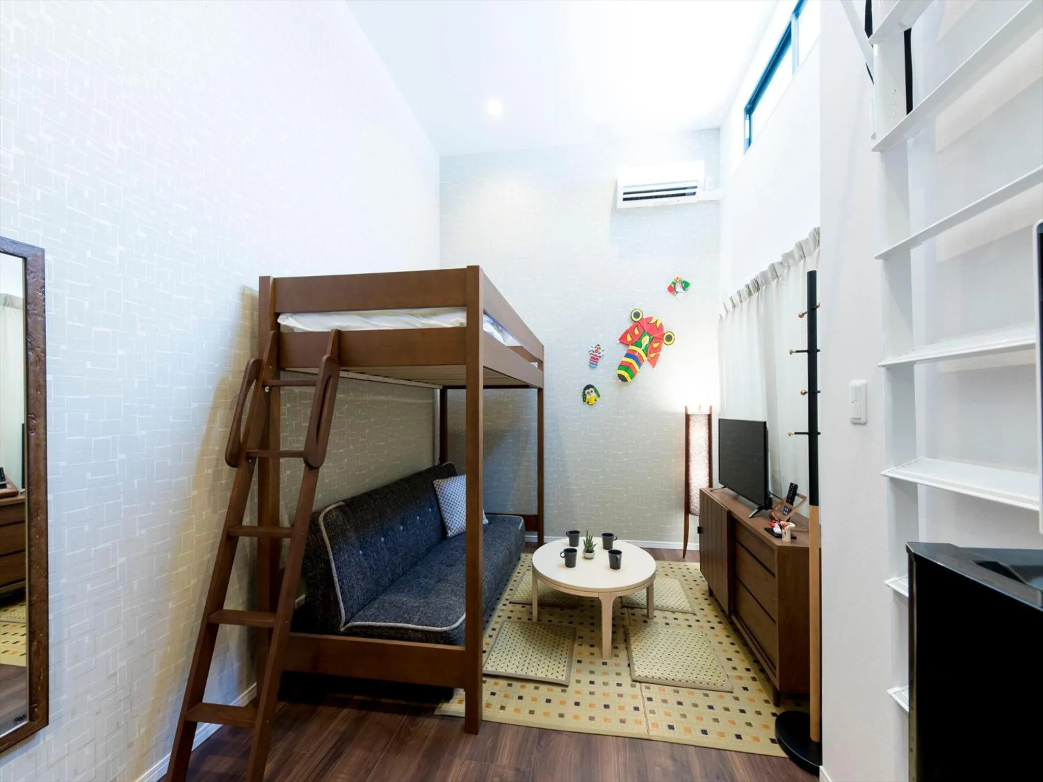 Living room, Bed in TRIP POD SUMIYOSHI A