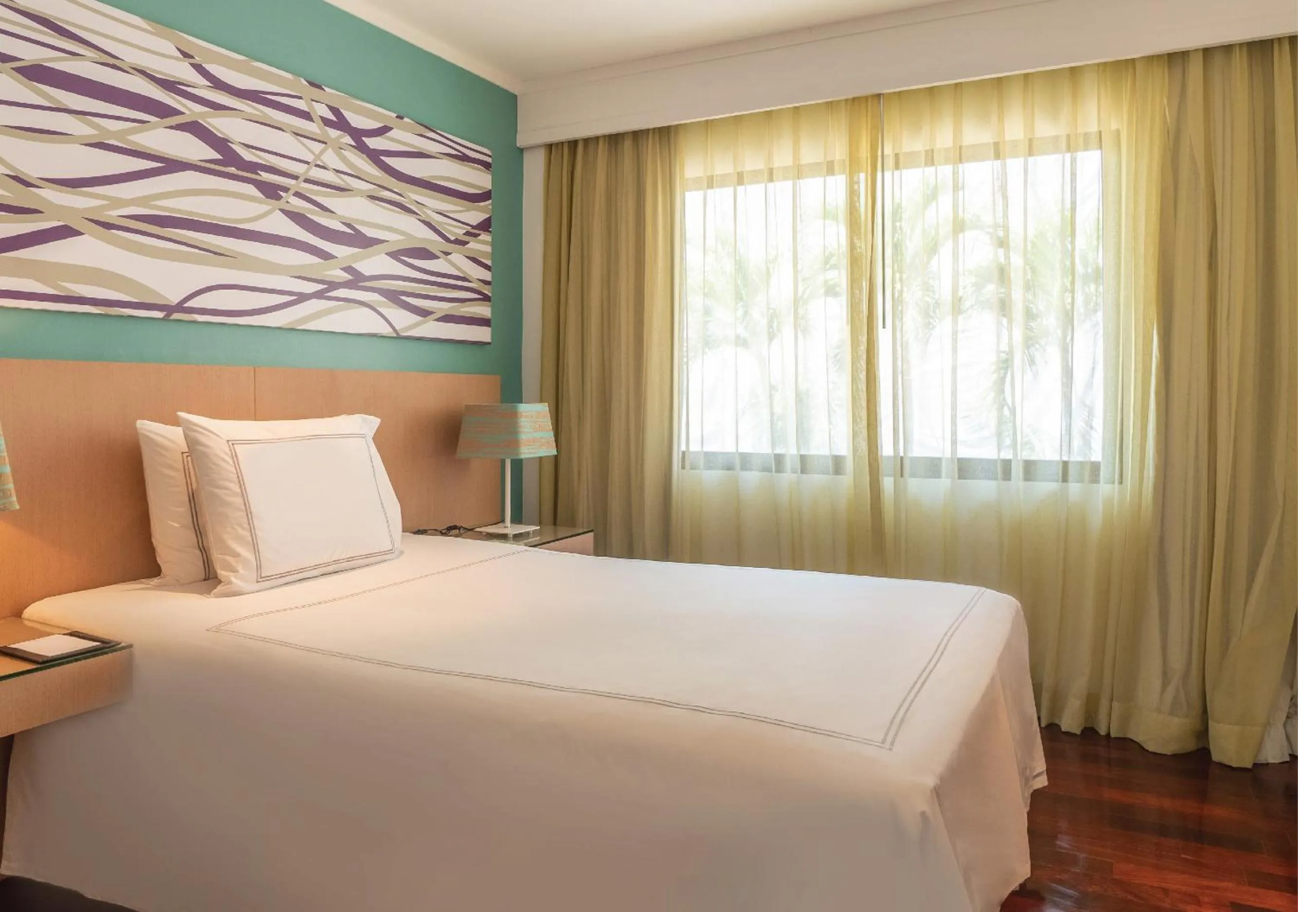 Bed in Radisson Resort and Suites Phuket