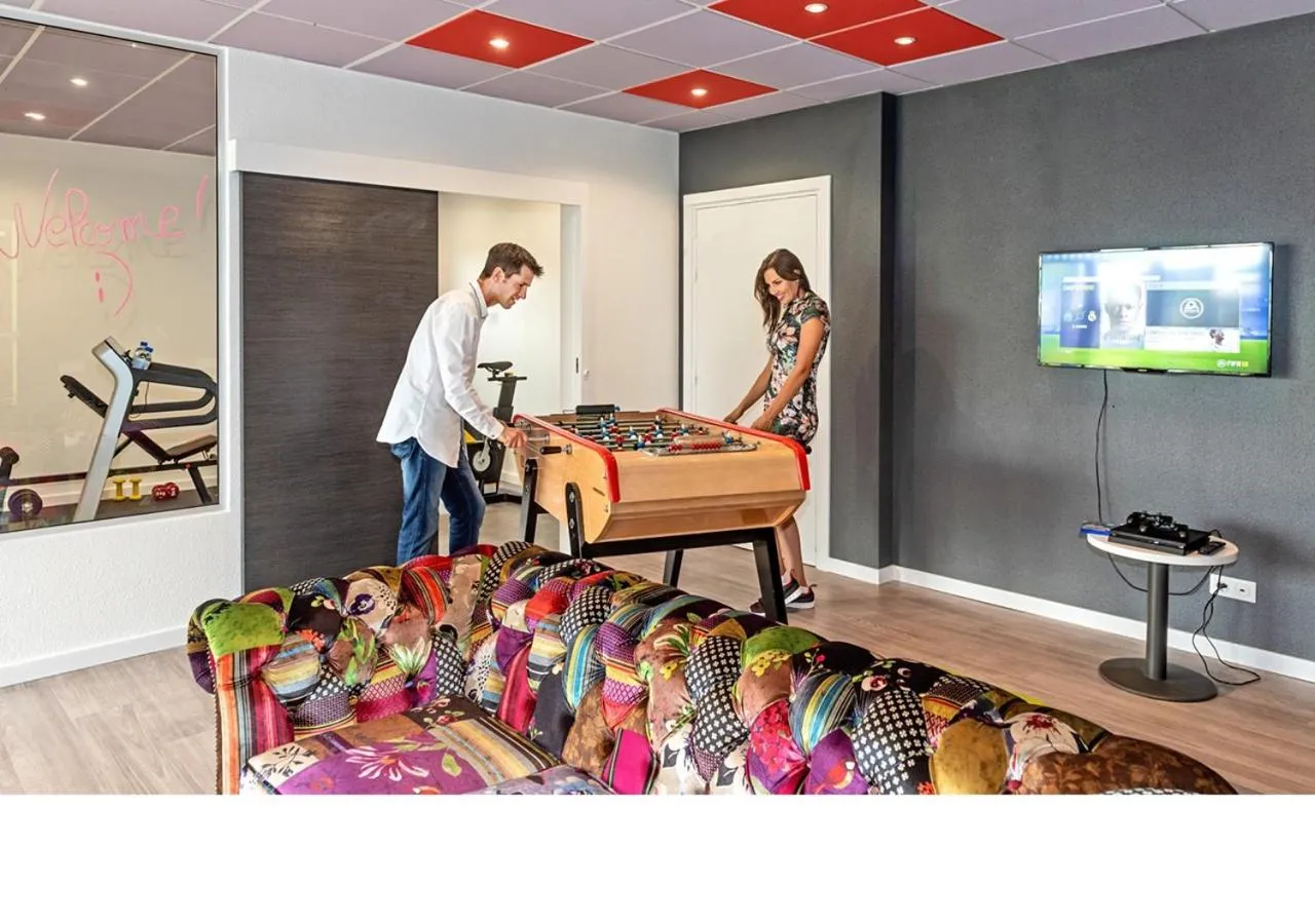 Communal lounge/ TV room in ibis budget Strasbourg Sud Illkirch