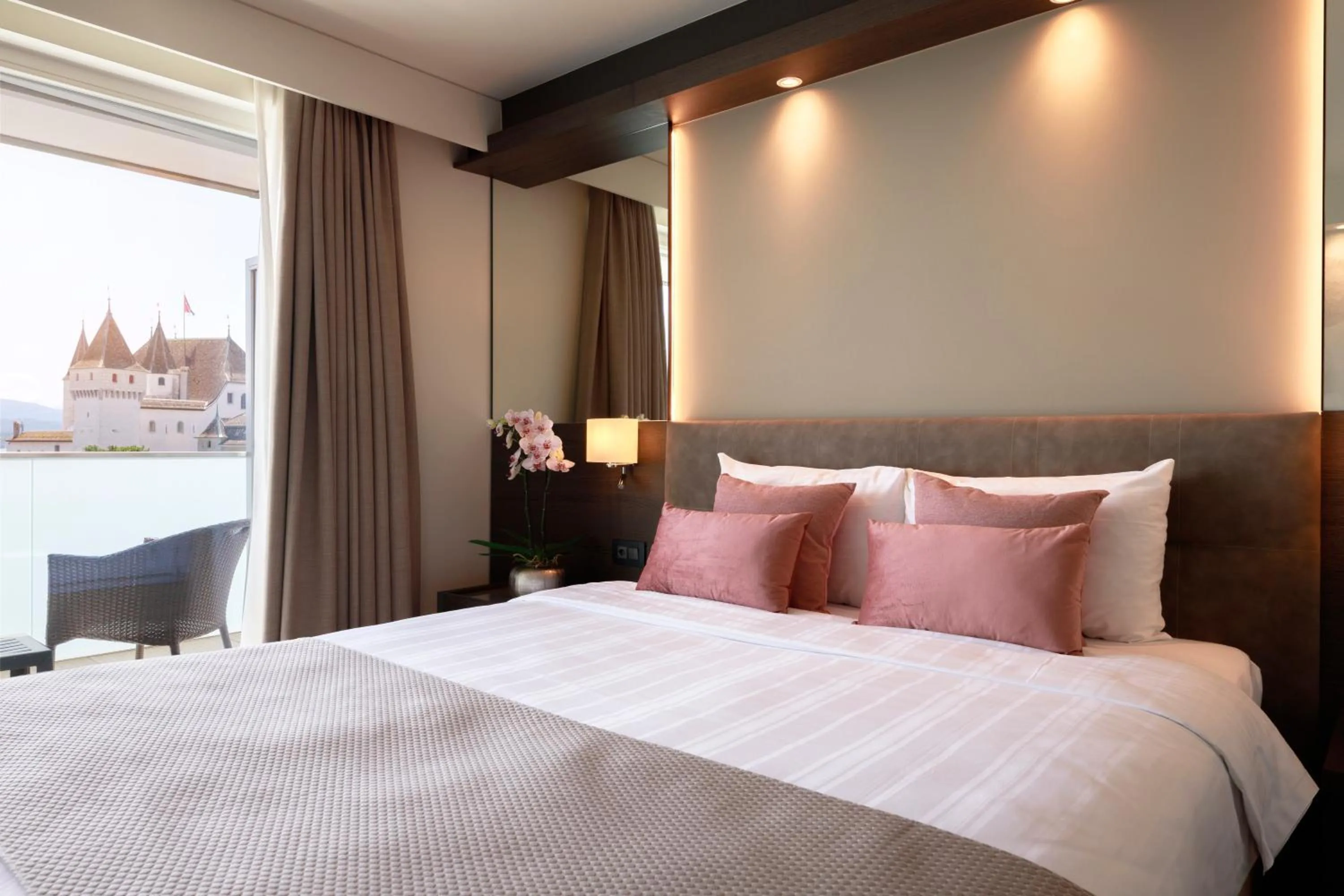 Bed in Ambassador Boutique Hotel