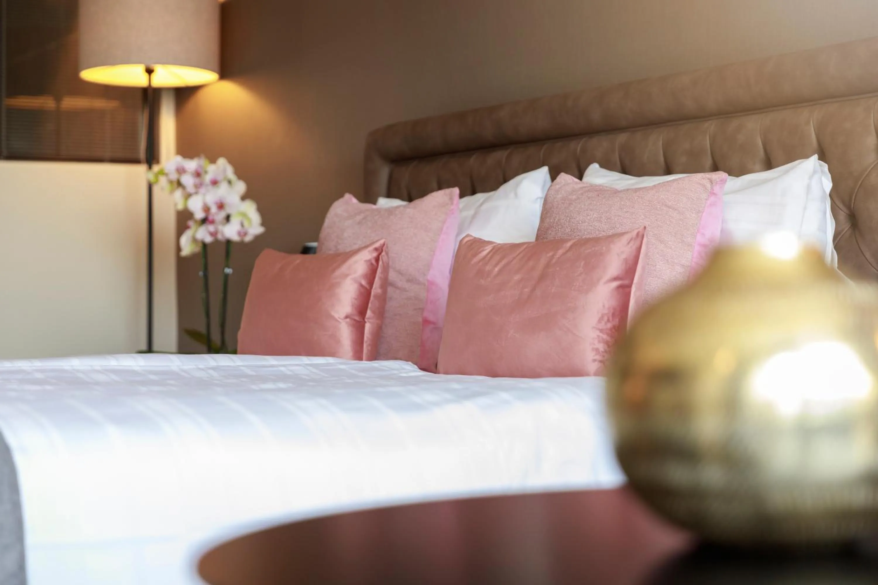 Bed in Ambassador Boutique Hotel