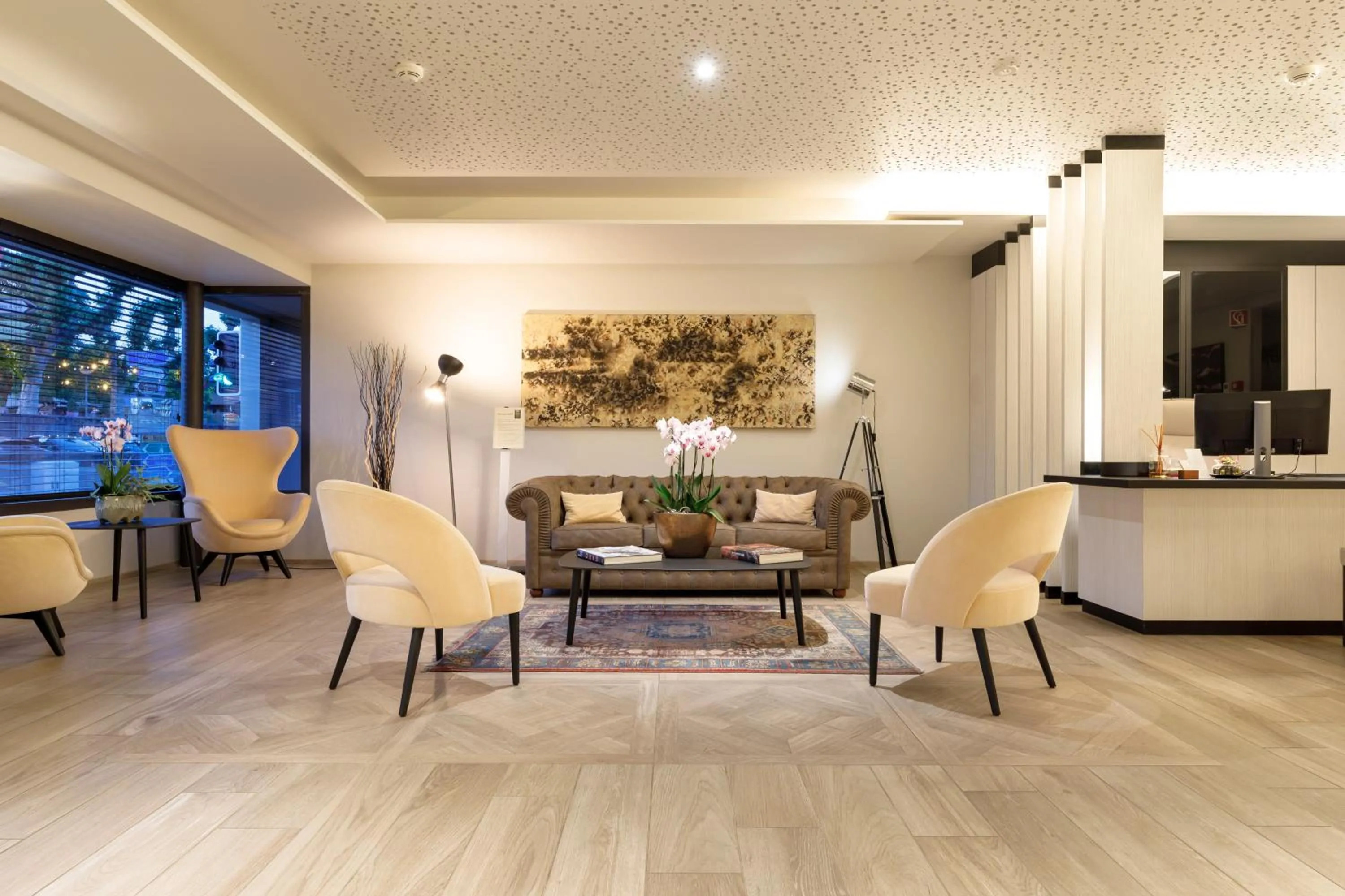 Lobby or reception in Ambassador Boutique Hotel