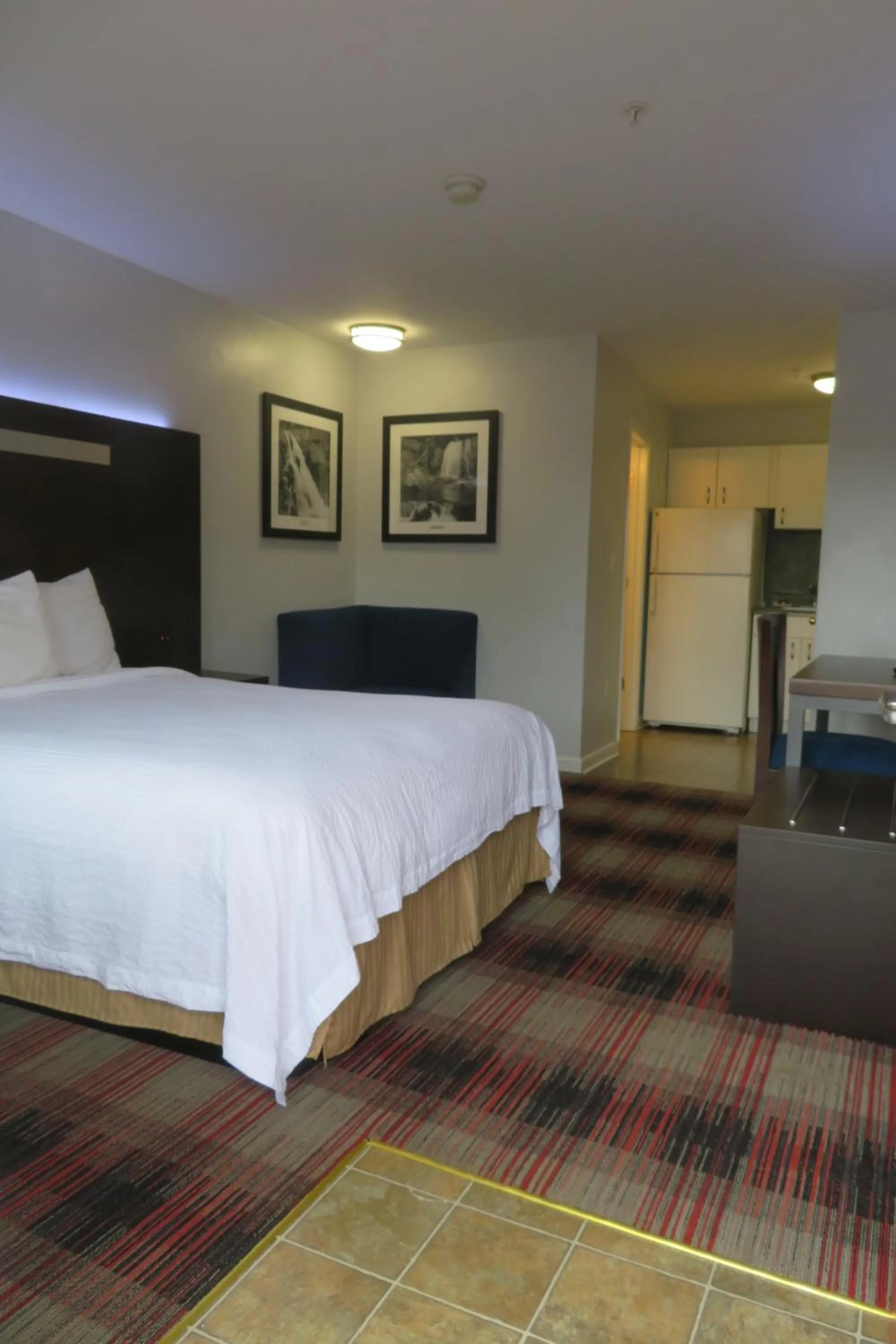 Bed in Luxbury Inn & Suites