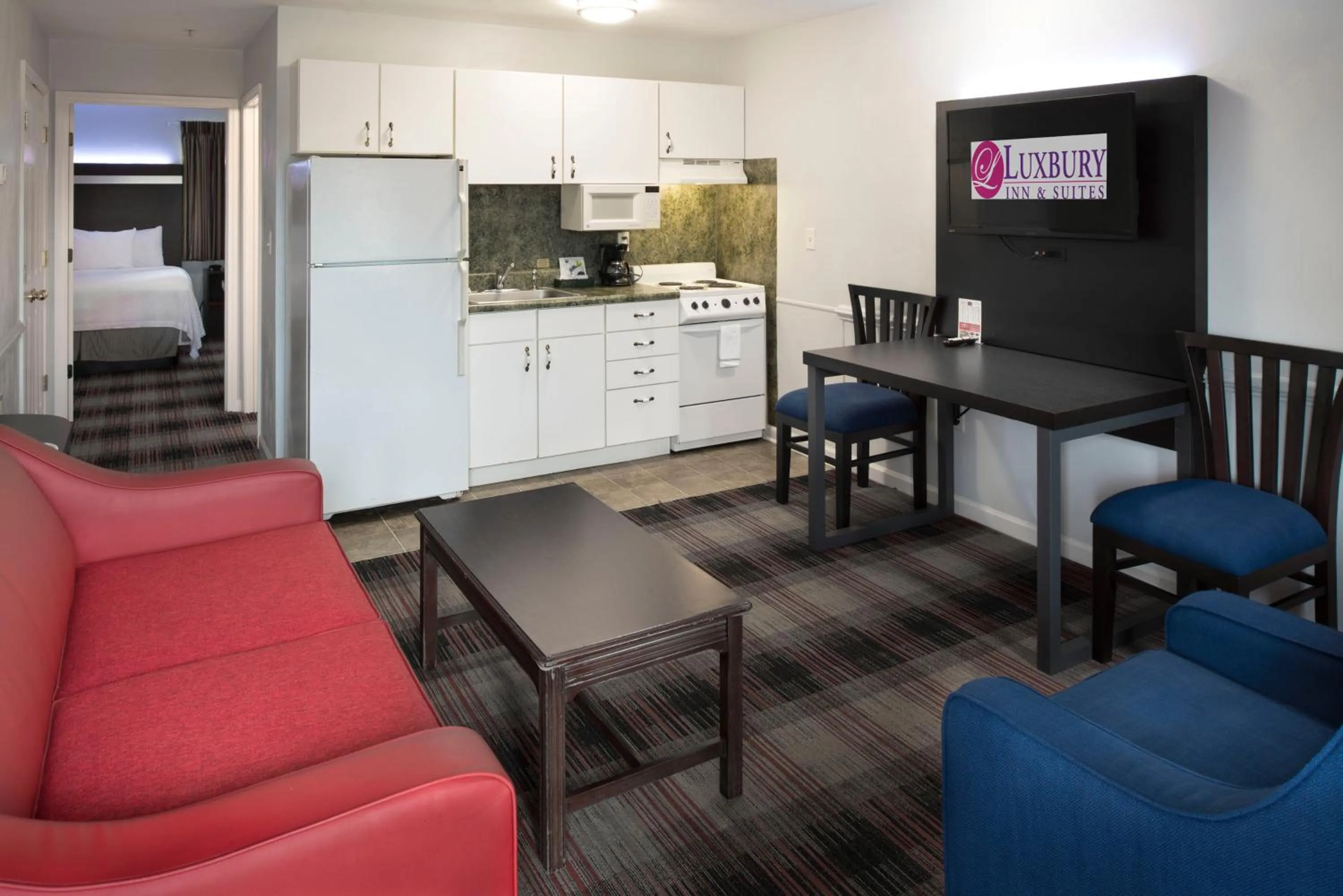 Living room in Luxbury Inn & Suites