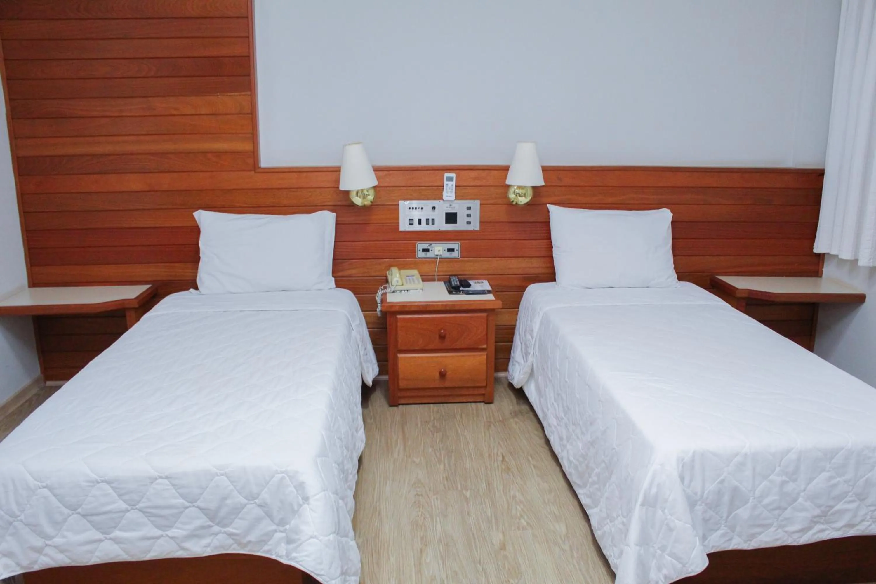 Bed in HD Plaza Hotel