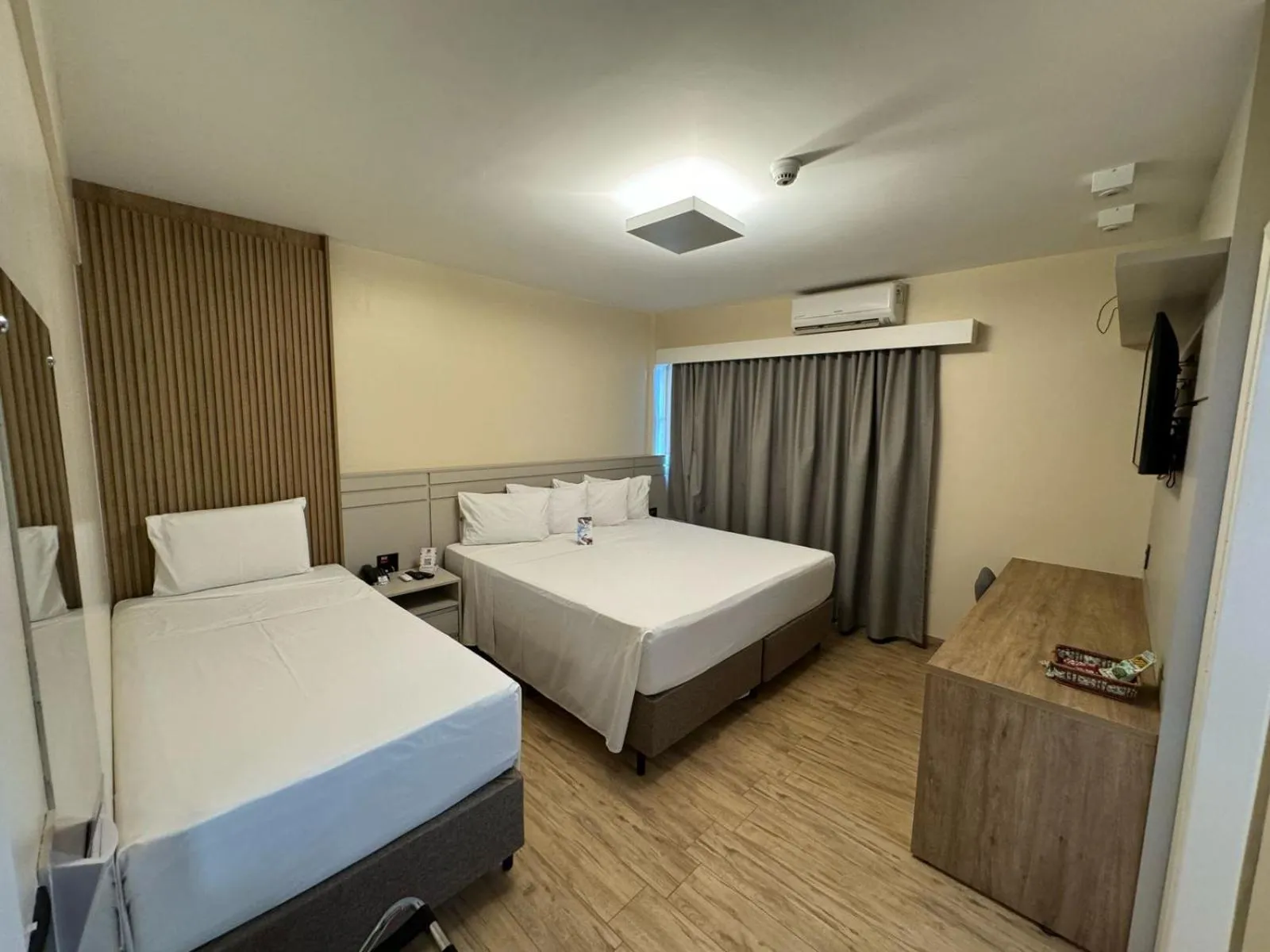 Bed in HD Plaza Hotel