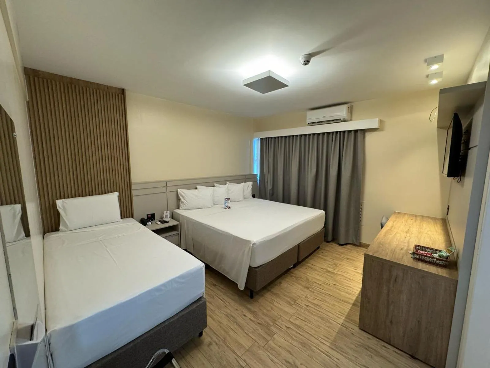 Bed in HD Plaza Hotel