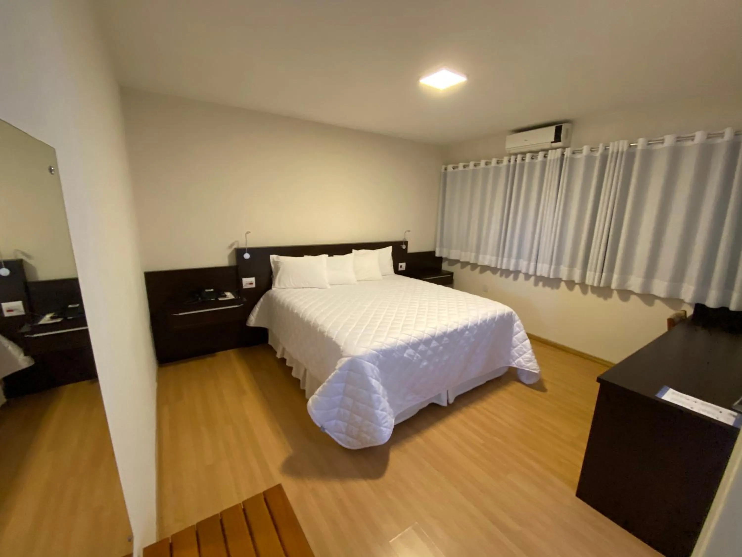 Bed in HD Plaza Hotel