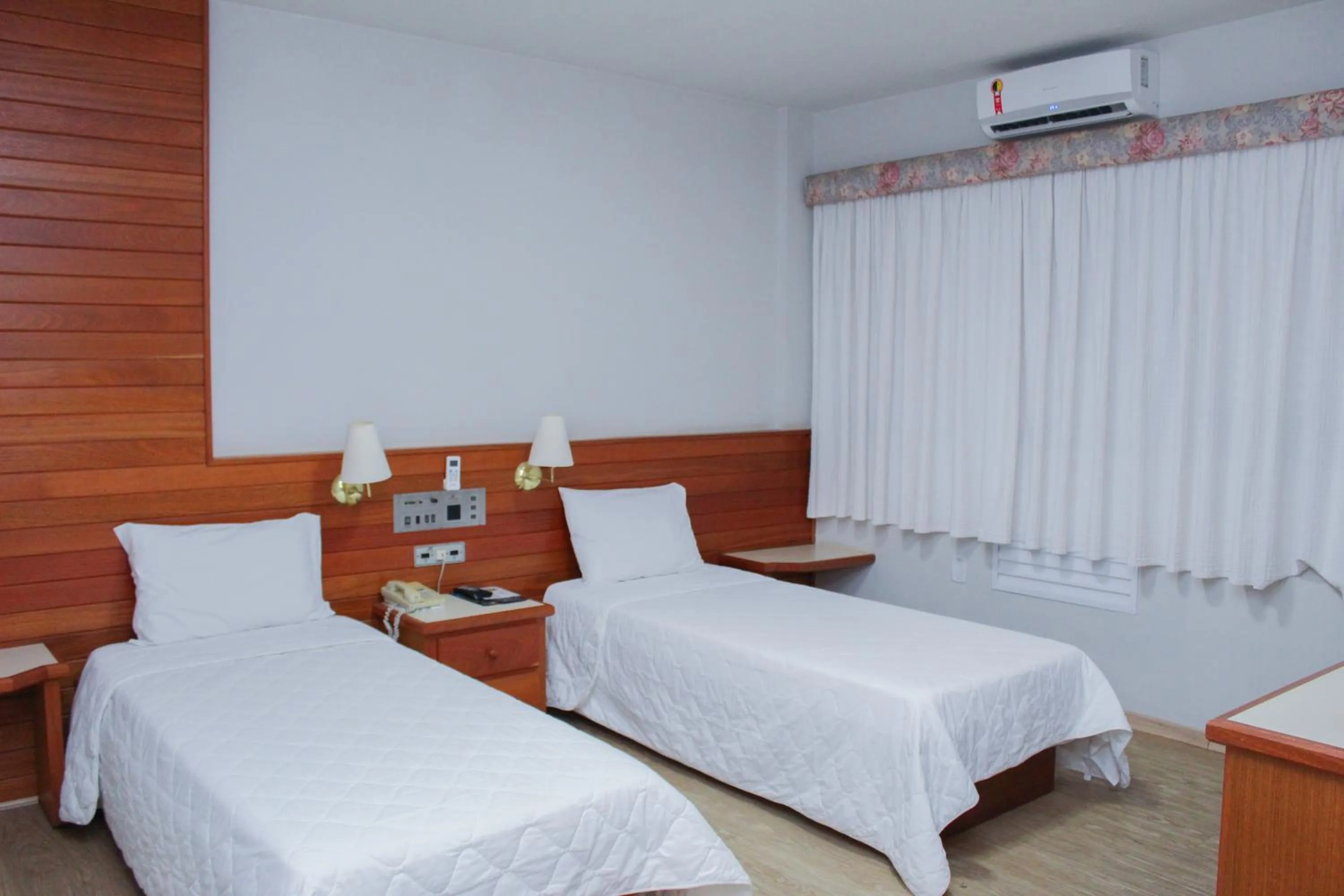 Bed in HD Plaza Hotel