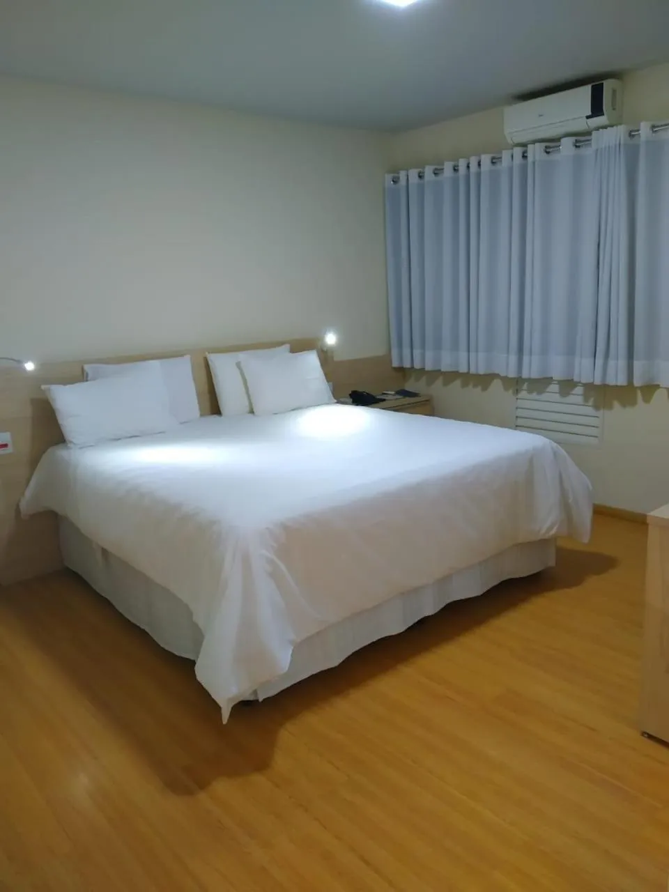 Bed in HD Plaza Hotel