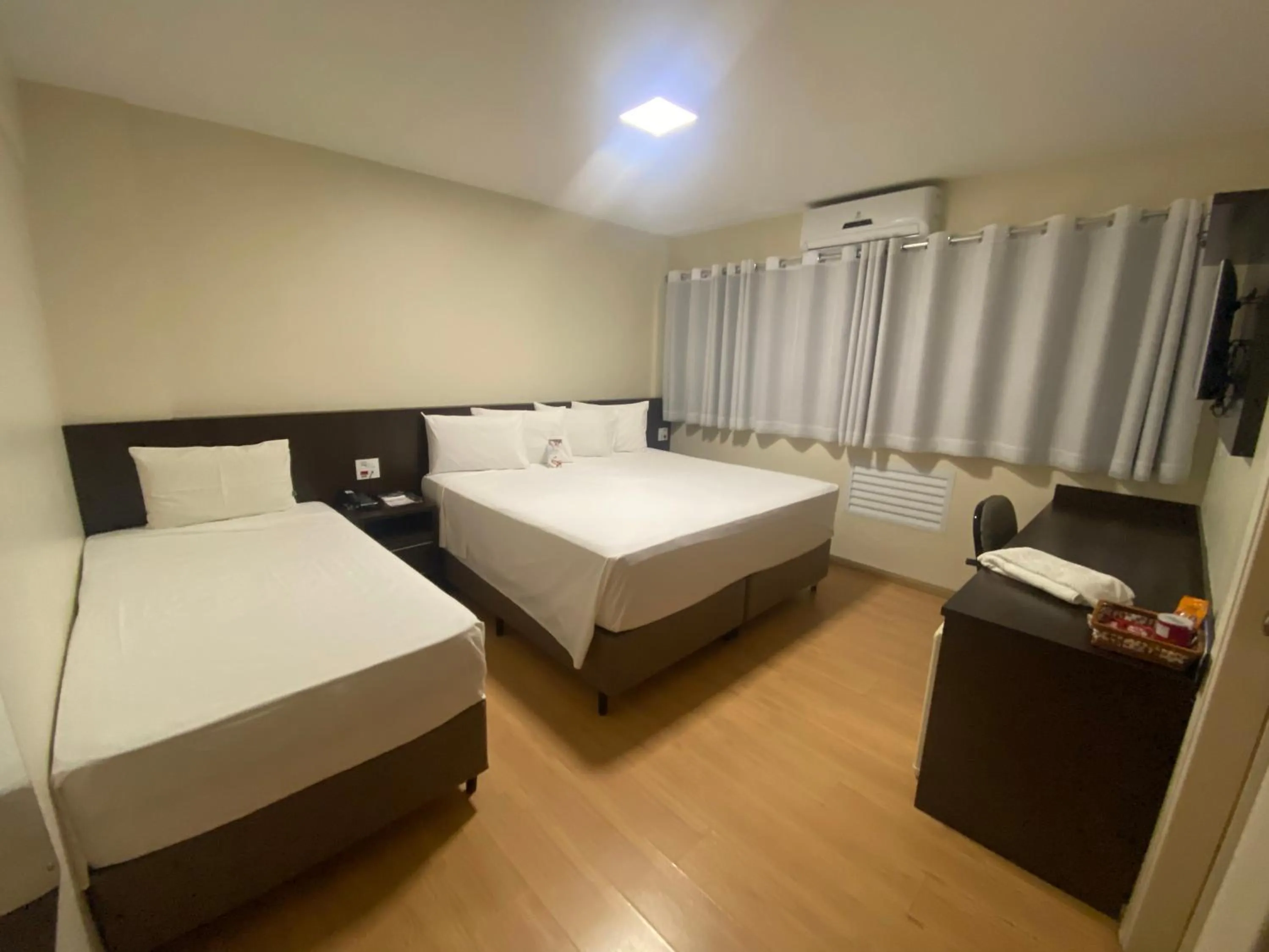 Bed in HD Plaza Hotel