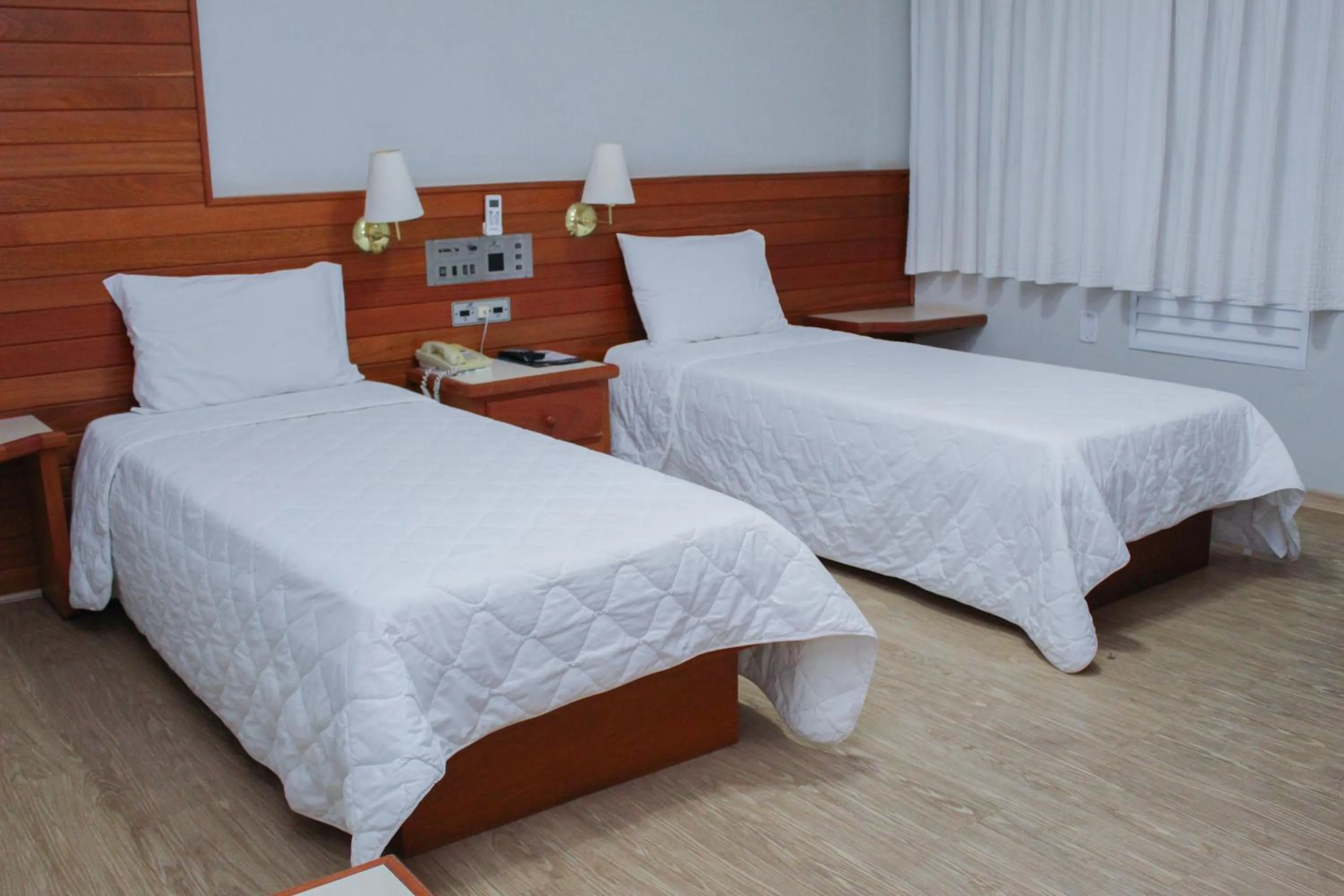 Bed in HD Plaza Hotel