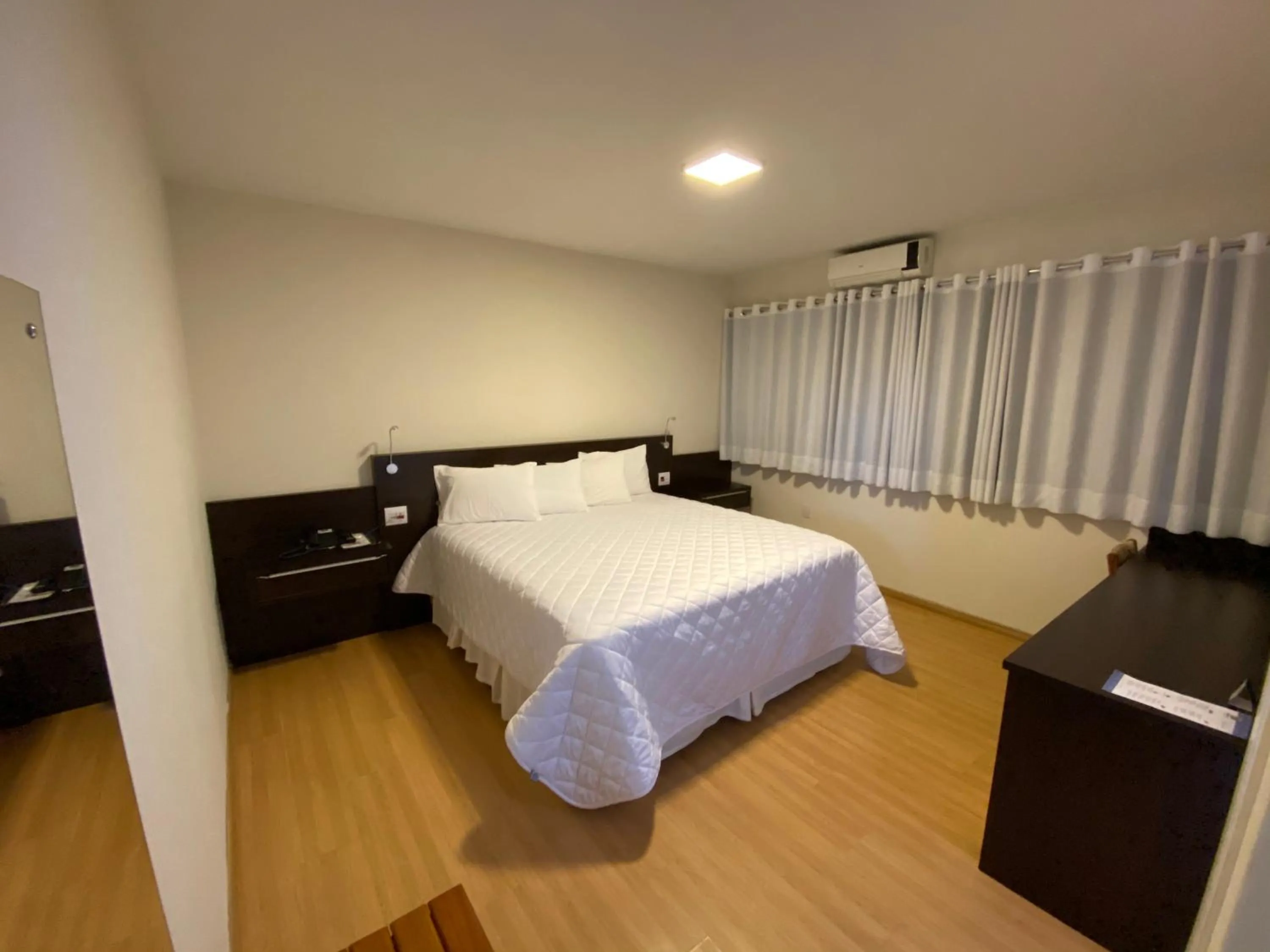 Bed in HD Plaza Hotel