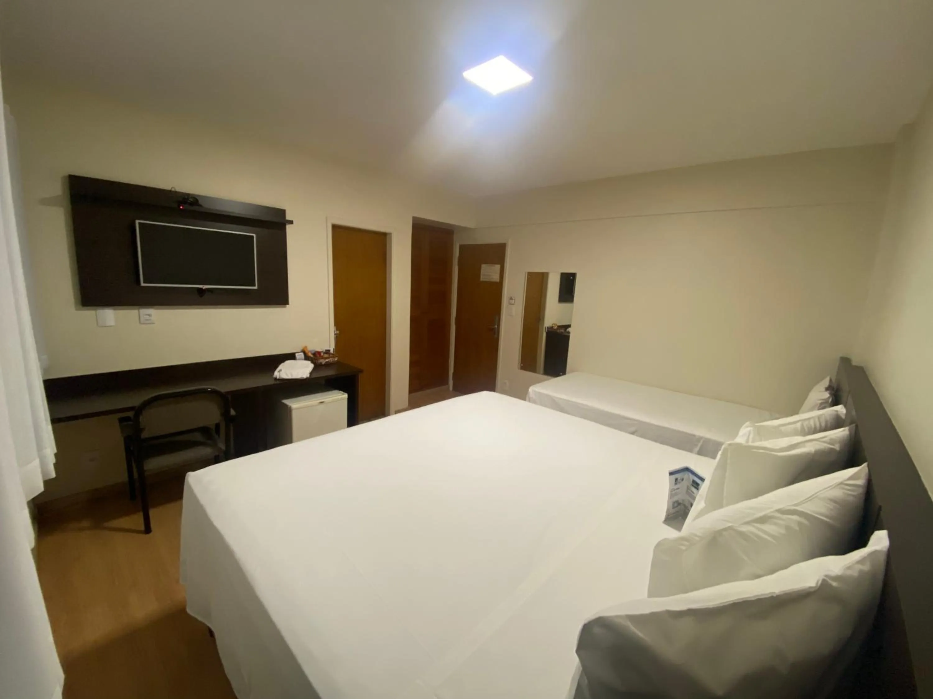 Bed in HD Plaza Hotel