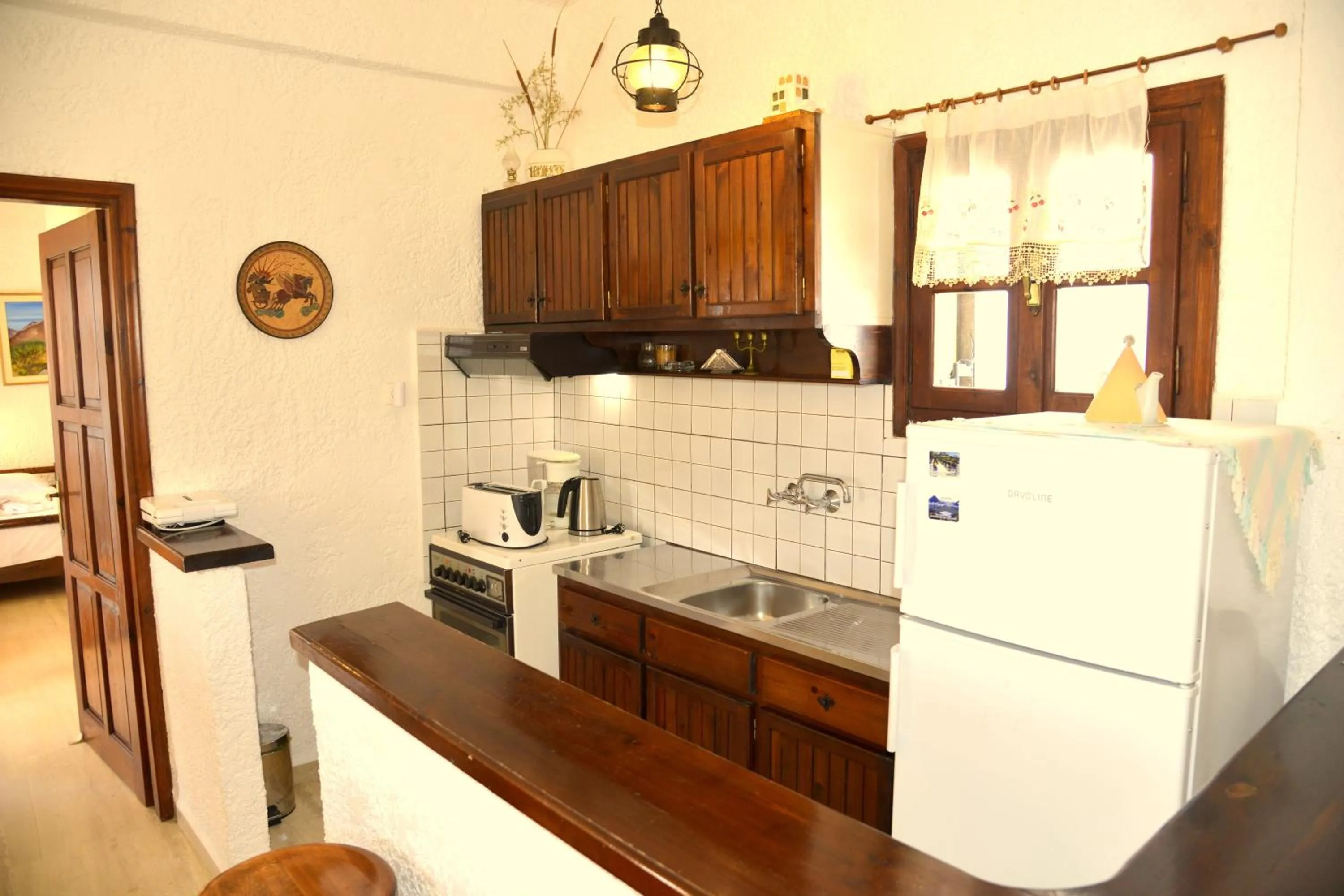 Kitchen or kitchenette in Filoxenia Villa