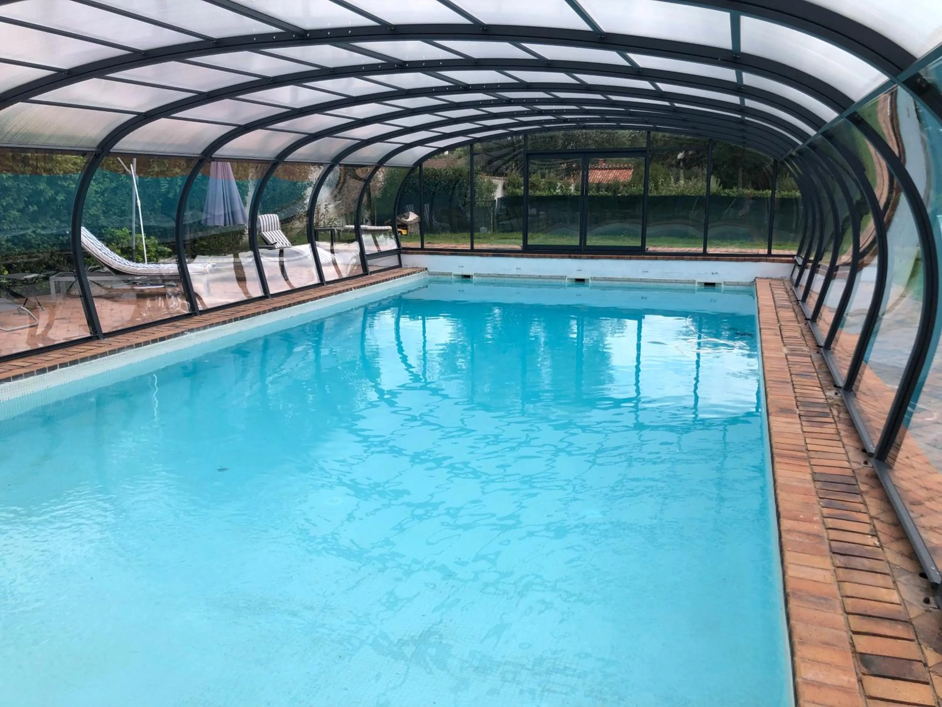 Pool view in ORANGERIE de CHATEL-Selection FIGARO & ELLE Magazine