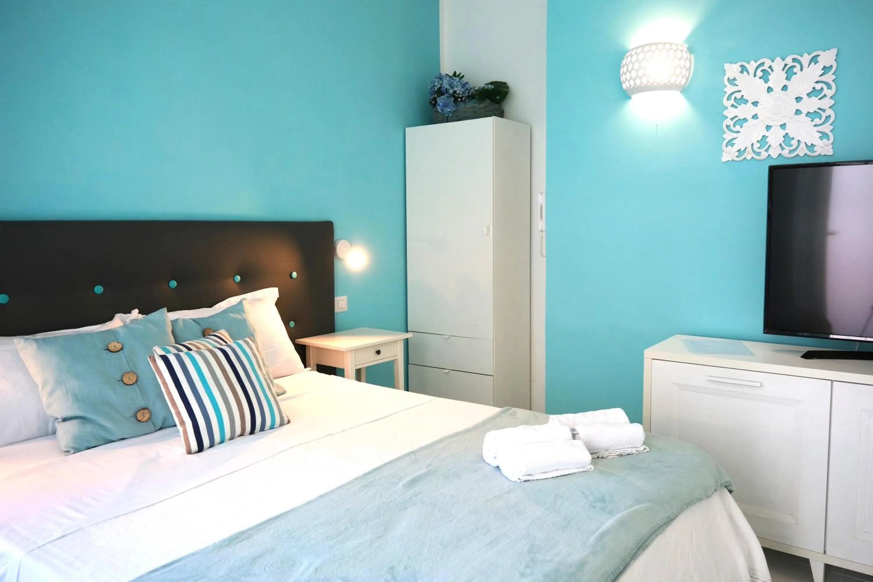 Bed in Pharus Miseni Suites and rooms