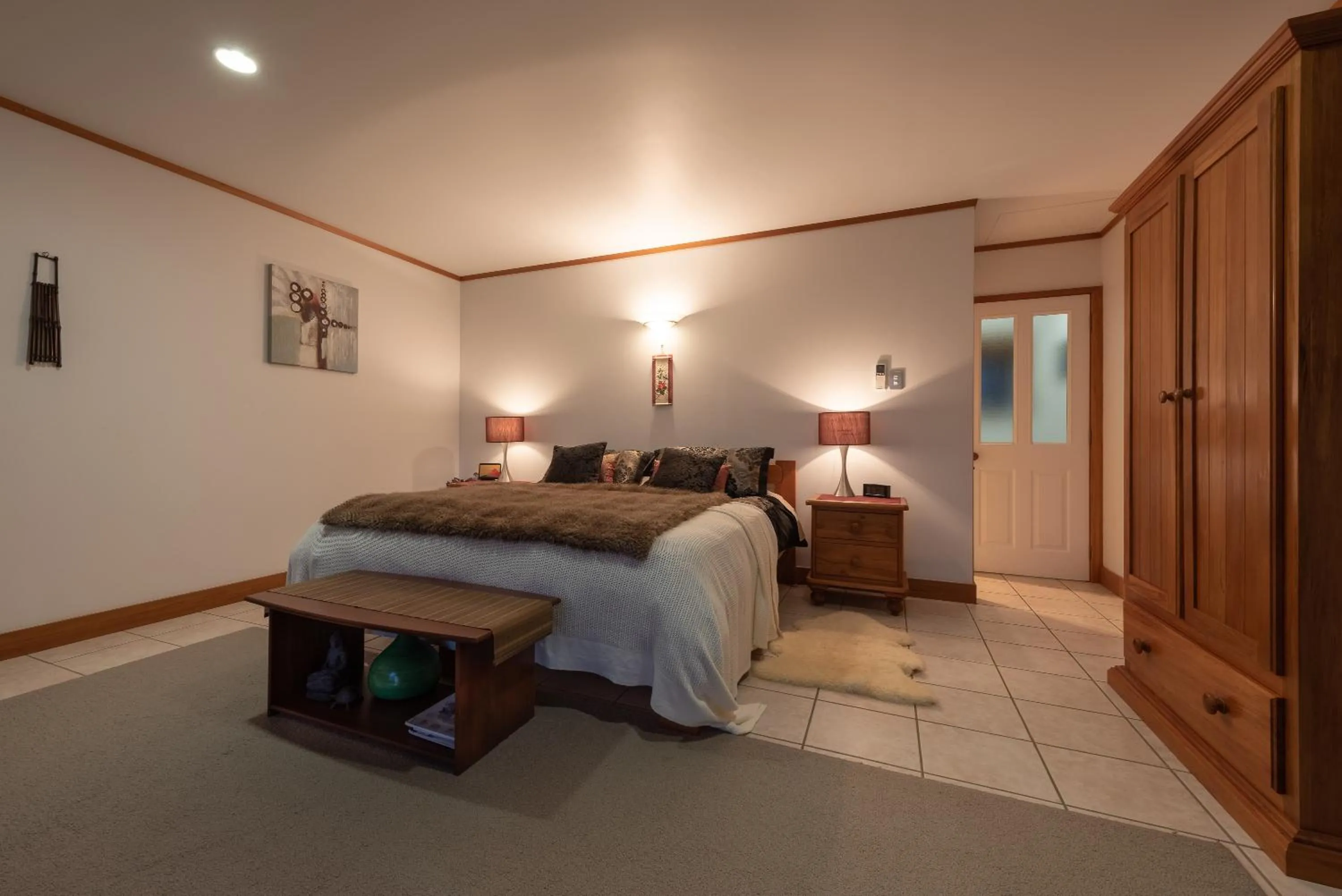 Bed in Puketotara Lodge