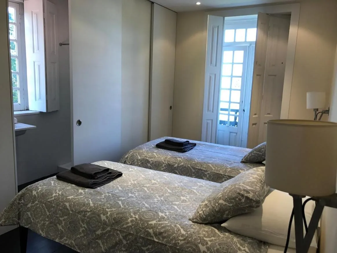 Bed in Camelia Rooms