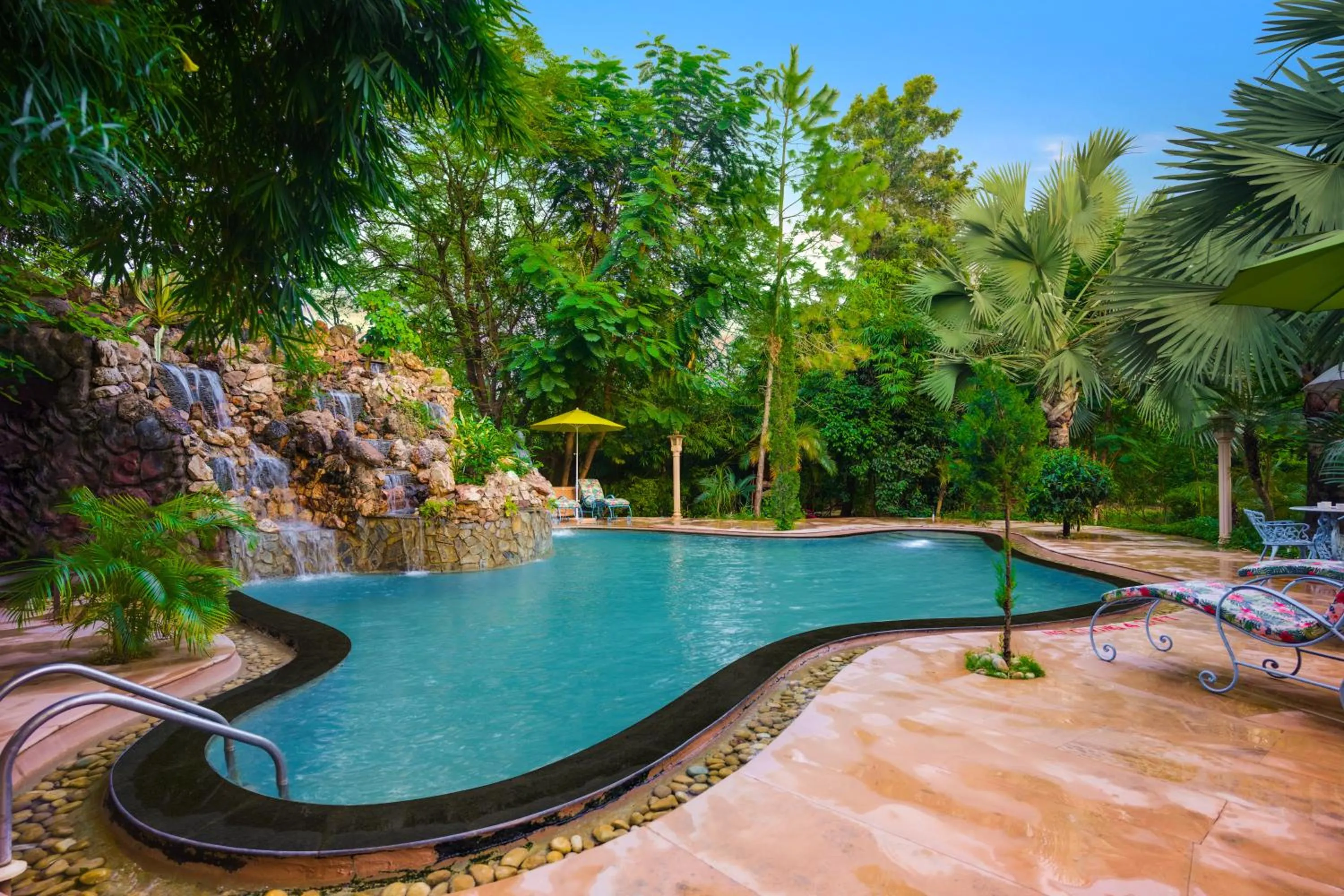 Swimming pool in The Tree House Resort, A Club Mahindra Associate