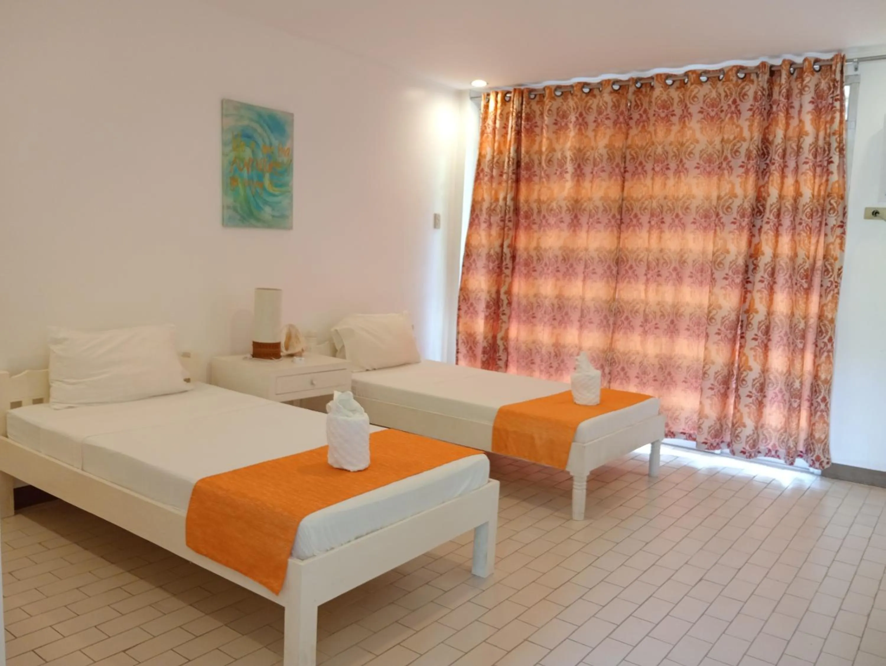 Bed in 1888 Beach Resort